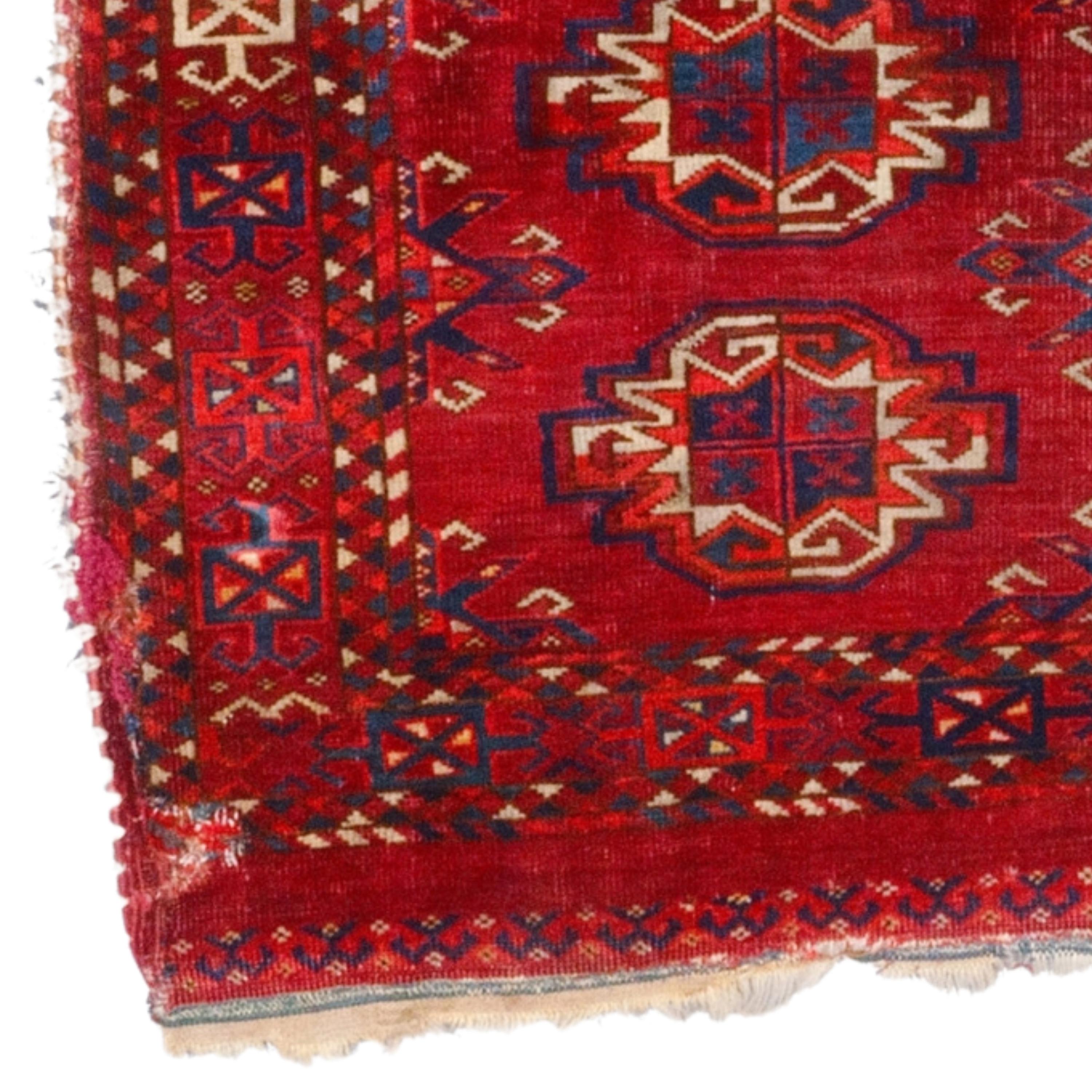 This elegant 19th century Ersari Chuval rug is a work of art that will enhance any space with its carefully chosen color palette and sophisticated patterns. Traditional motifs embroidered on a red background reveal the unique beauty of this work and