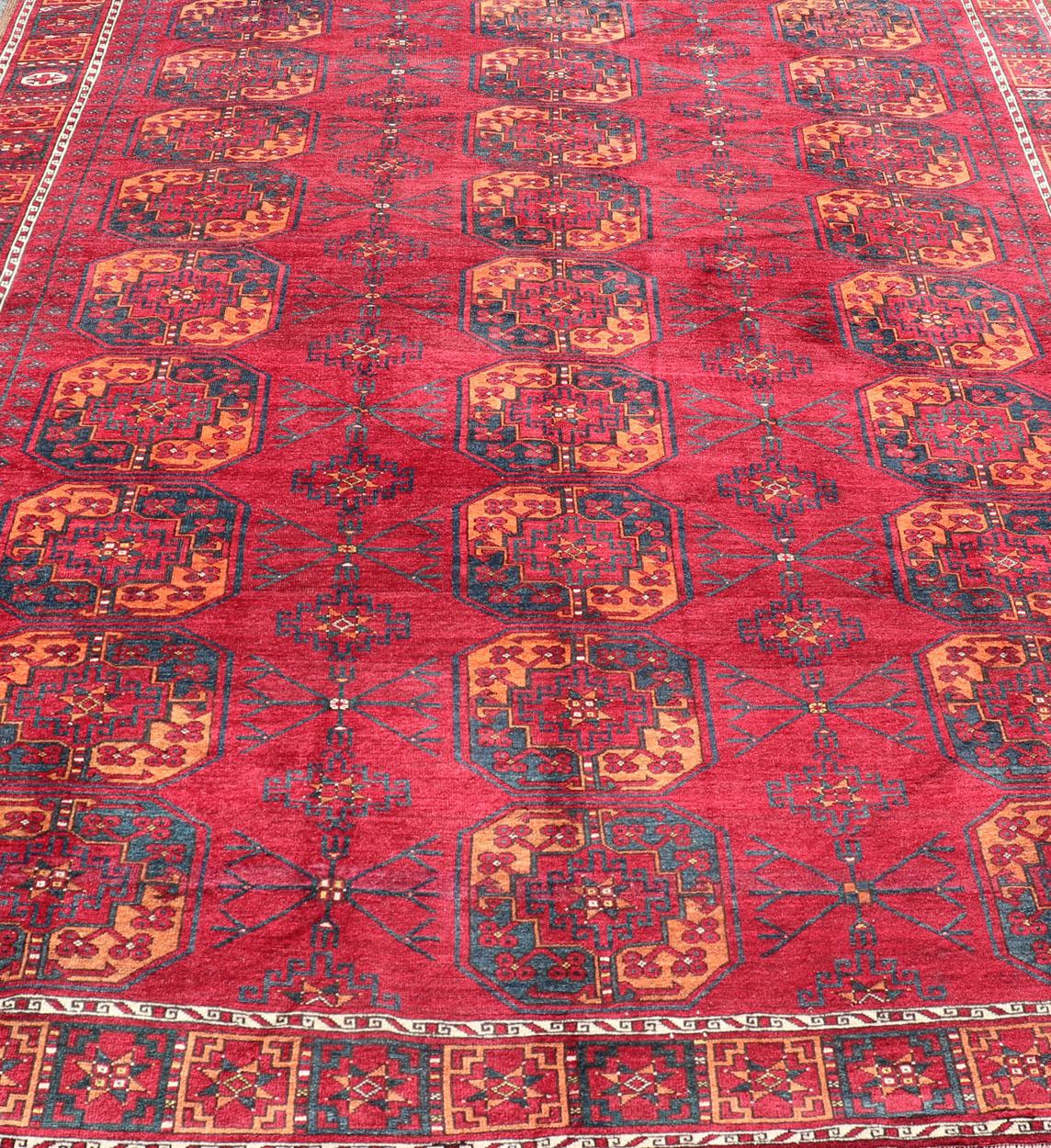 Hand-Knotted Antique Ersari Rug in Wool with Gul Design in Ivory, Blue, Red and Orange For Sale