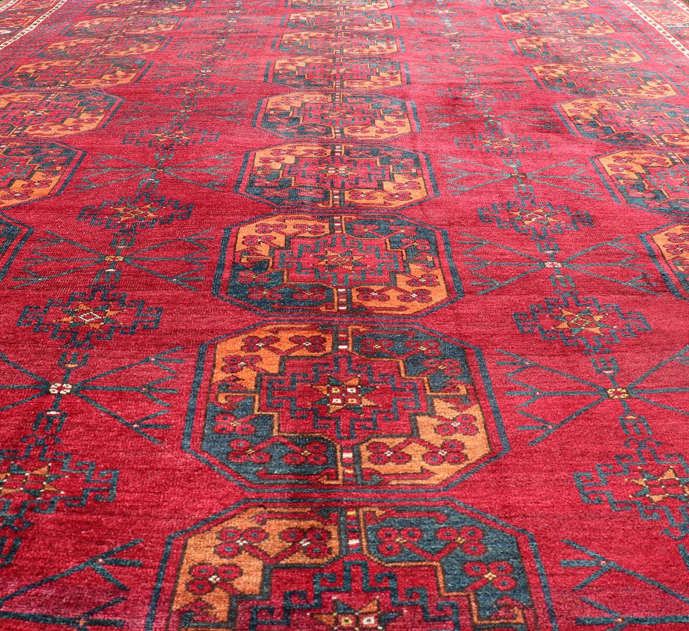 Antique Ersari Rug in Wool with Gul Design in Ivory, Blue, Red and Orange In Good Condition For Sale In Atlanta, GA