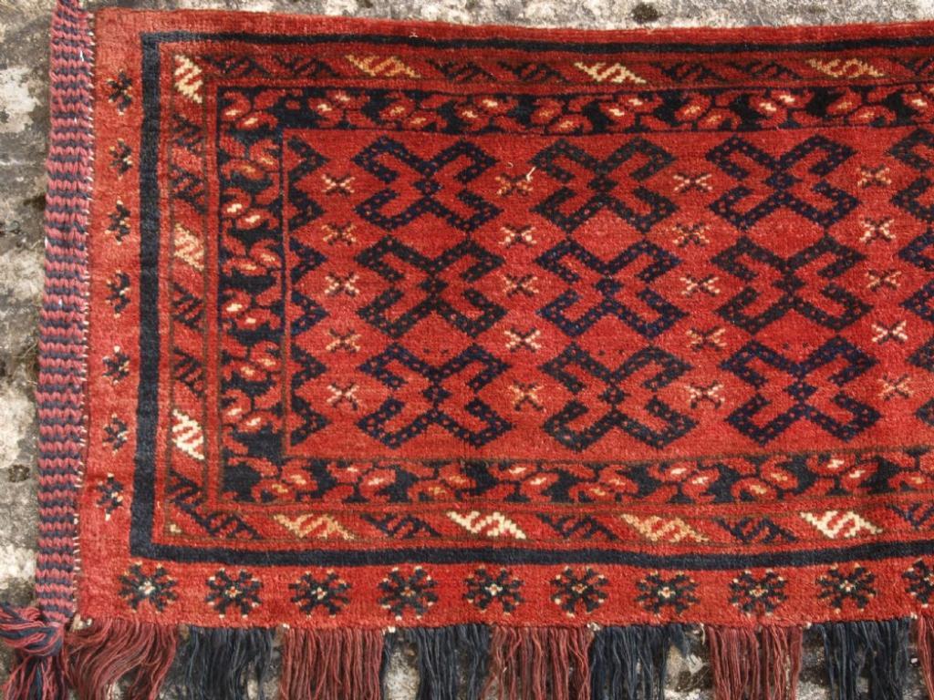 Antique Ersari Turkmen torba with interesting design often found on flat woven torba
Late 19th century

A good Ersari torba with excellent colour and superb soft wool The torba is complete with the original hanging cords and tassels

The torba is in