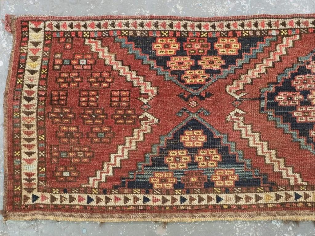Antique Ersari Turkmen torba with scarce floral rosette design
2nd half 19th century

This is an interesting torba which belongs to a well documented group of Ersari weavings from the 2nd half of the 19th century The torba has a floral rosette
