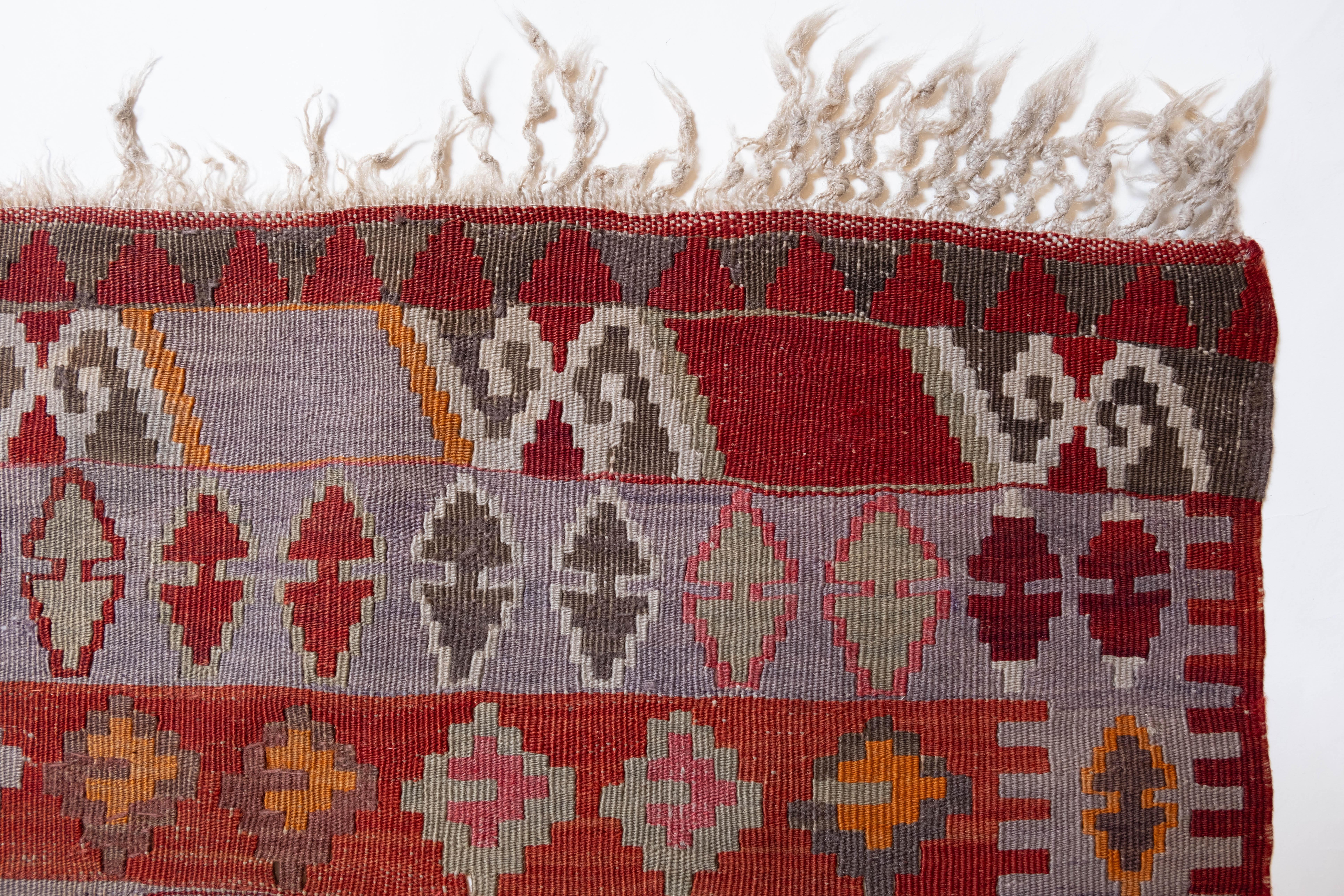 This is Eastern Anatolian antique Kilim from the Erzurum region with a rare and beautiful color composition. 

This highly collectible antique kilim has wonderful special colors and textures that are typical of an old kilim in good condition. It is