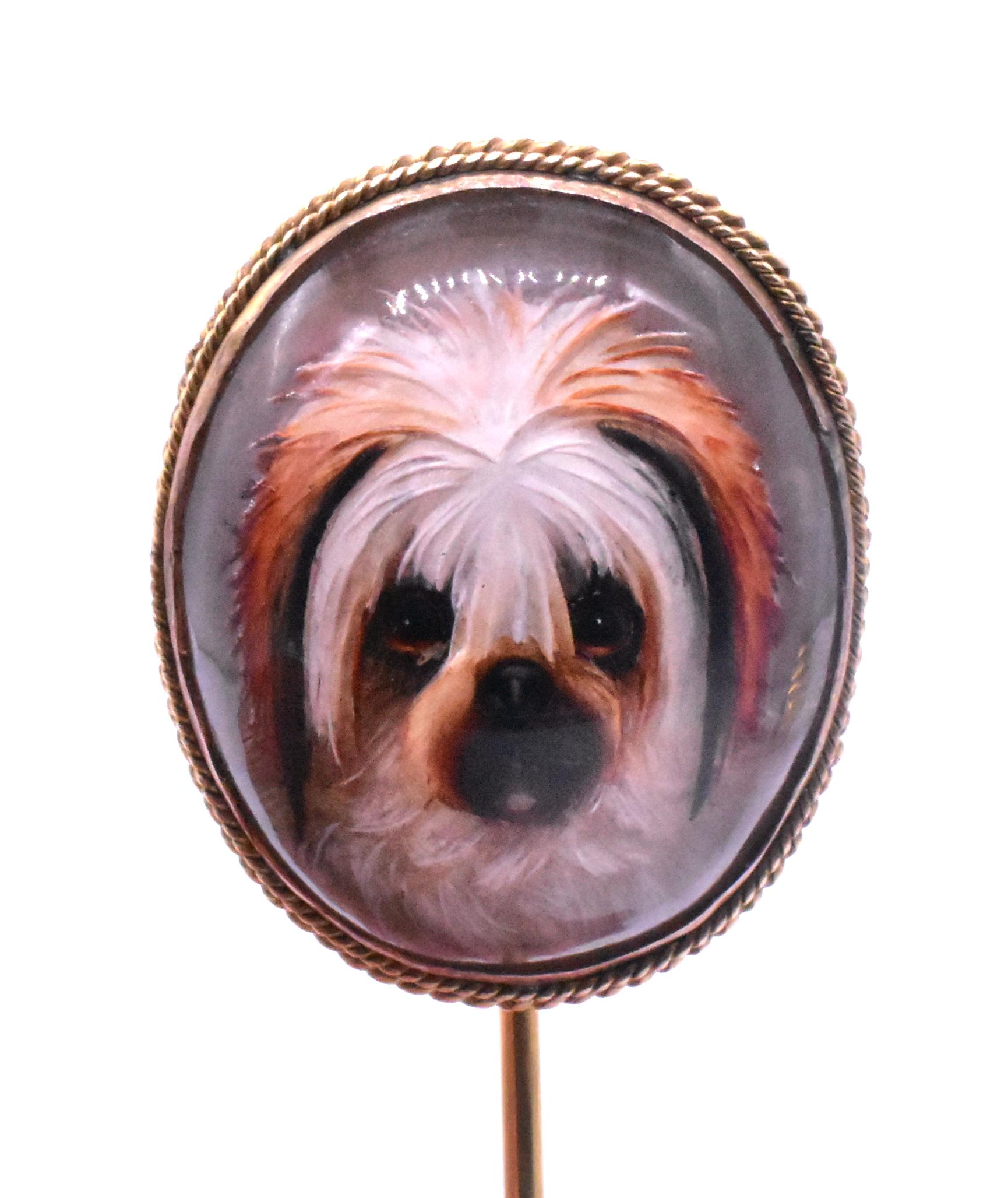 Victorian stickpin of a bearded collie or English sheepdog in Essex crystal and set in an 18K twisted rope border around its frame and a large 9K gold pin that measures 4.25 inches long including the pin. Keep your lovely furry companion with you