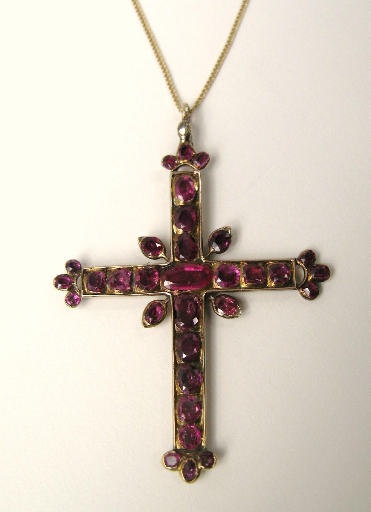 Very large Cross totally covered in Rubies set in 14K gold comes with a 14k gold chain. This is stunning in person. It measures 3.35