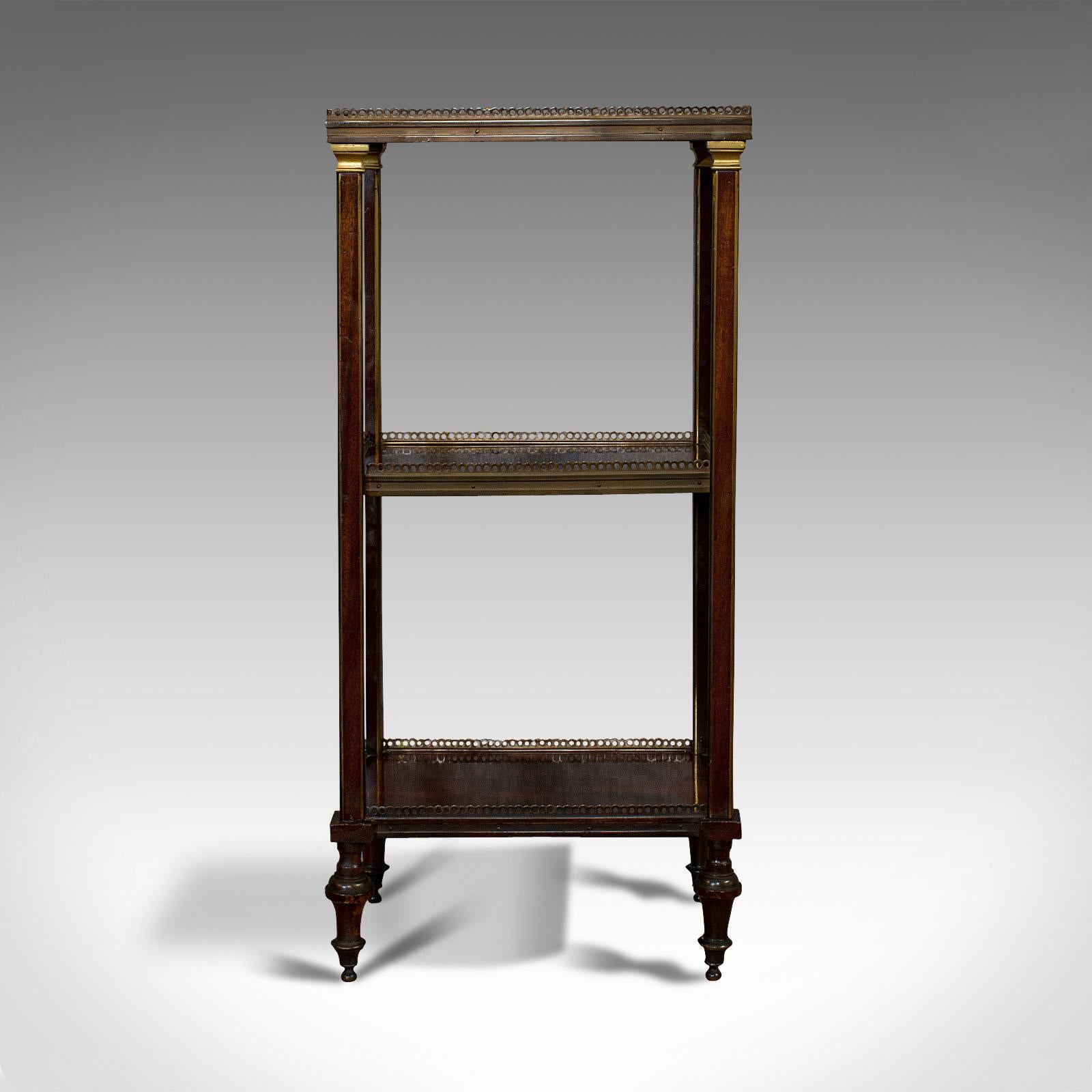 This is an antique étagère. An Italian, mahogany and brass 3-tier stand or whatnot, dating to the Victorian period, circa 1870.

Classic Italian craftsmanship
Displays a desirable aged patina
Select mahogany shows fine grain interest
Aged brass