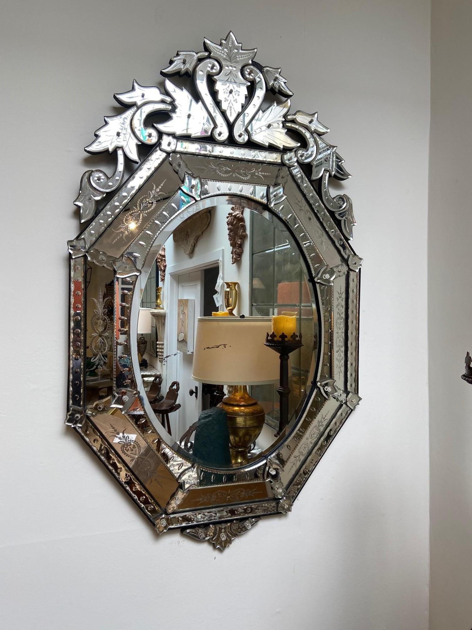 Antique Venetian mirror, etched and beveled made in France, multi part frame, rosettes at joints.