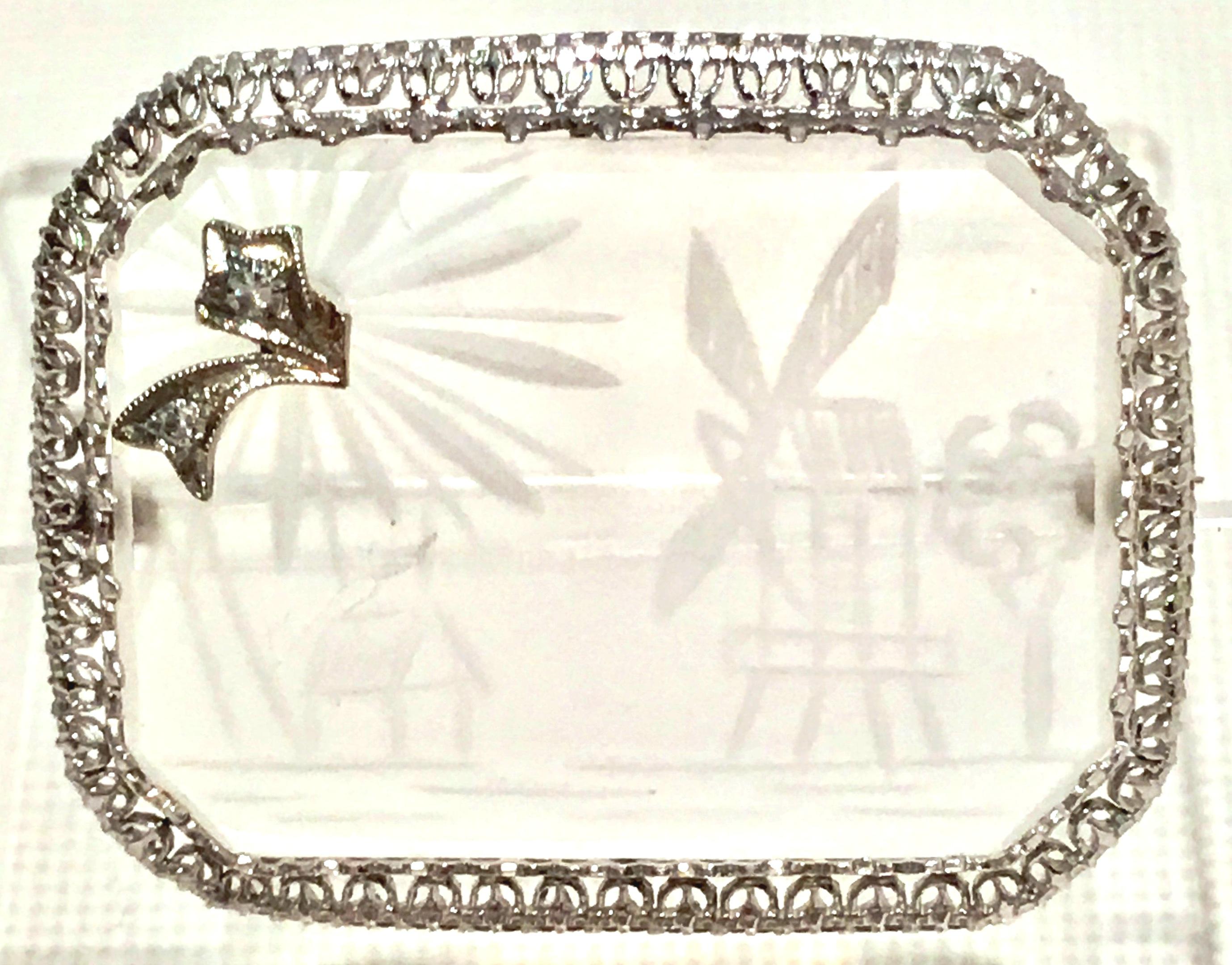 Antique Etched Rock Crystal & Diamond Platinum Set Filigree Brooch. This rare piece features a filigree platinum setting with an etched rock crystal windmill & church with tree motif. Finished with a platinum set raised two diamond stone detail.