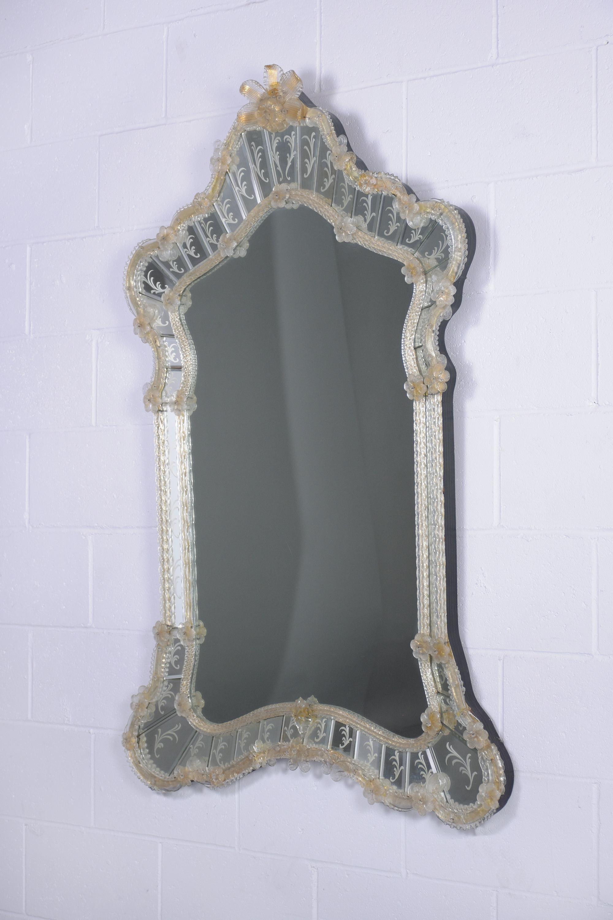 Discover the artistry of this extraordinary vintage Italian mirror, masterfully hand-crafted and preserved in very good condition. The mirror showcases a delicate etched leaf design encircling its periphery, adding to its elegance. What truly sets