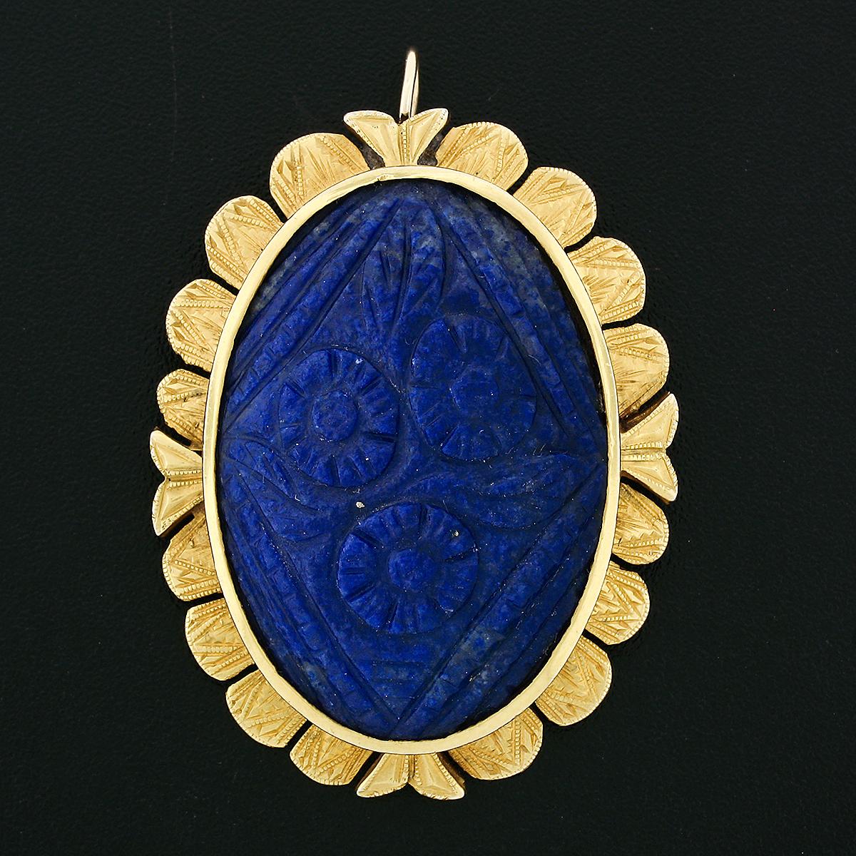 Here we have an antique pendant or brooch that was crafted from solid 14k yellow gold during the Victorian era. The brooch was made in the Etruscan Revival style and features a magnificent, TOP QUALITY, carved piece of natural lapis lazuli that is