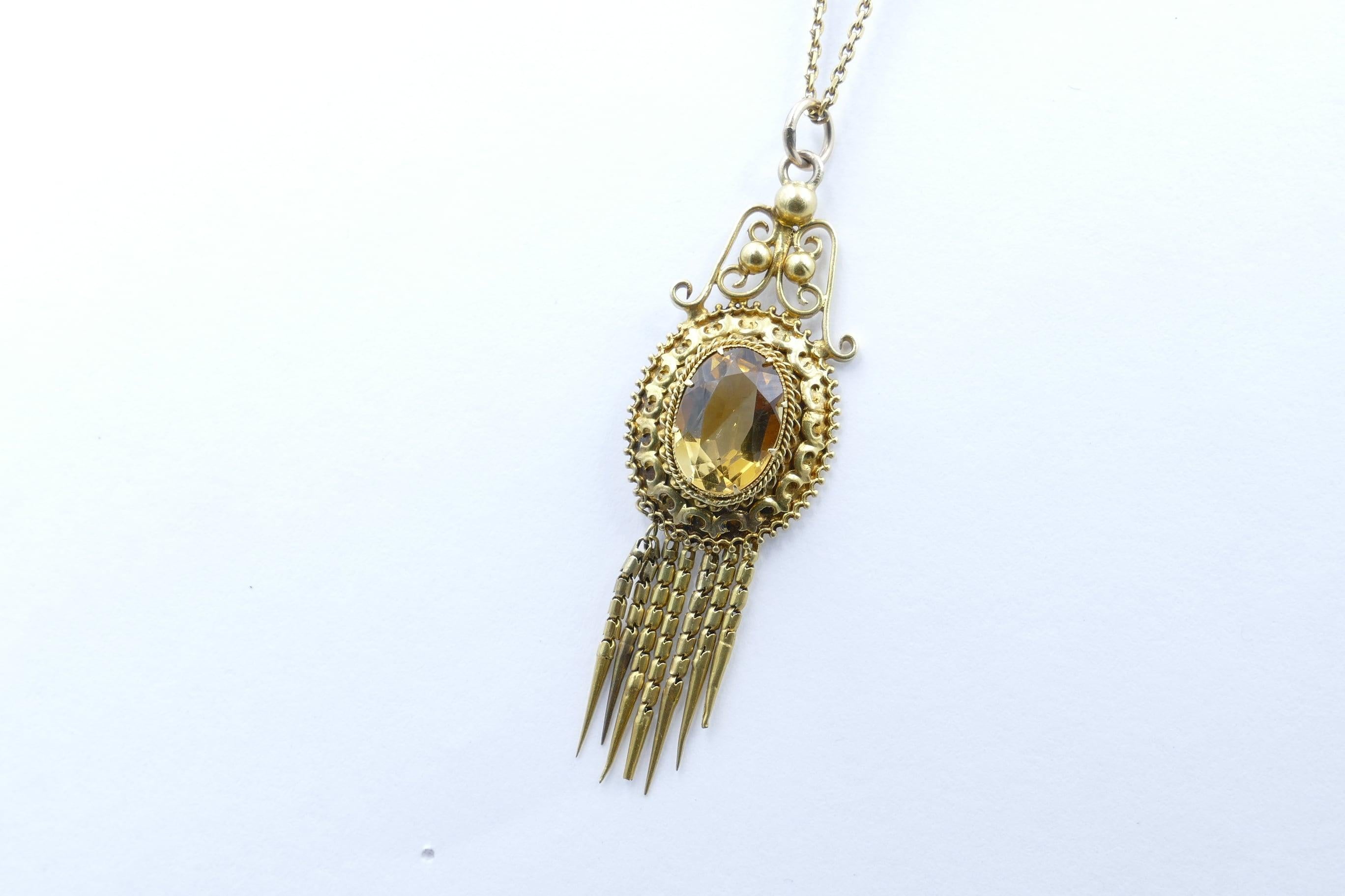 This gorgeous late 1880's Pendant is just beautiful.
The centrepiece feature is a 4.47 carat, very eye-clean, oval cut  deep yellow Citrine.
The Pendant from the Etruscan Revival period has scrolling motifs and bladed tassels.
It is in very very