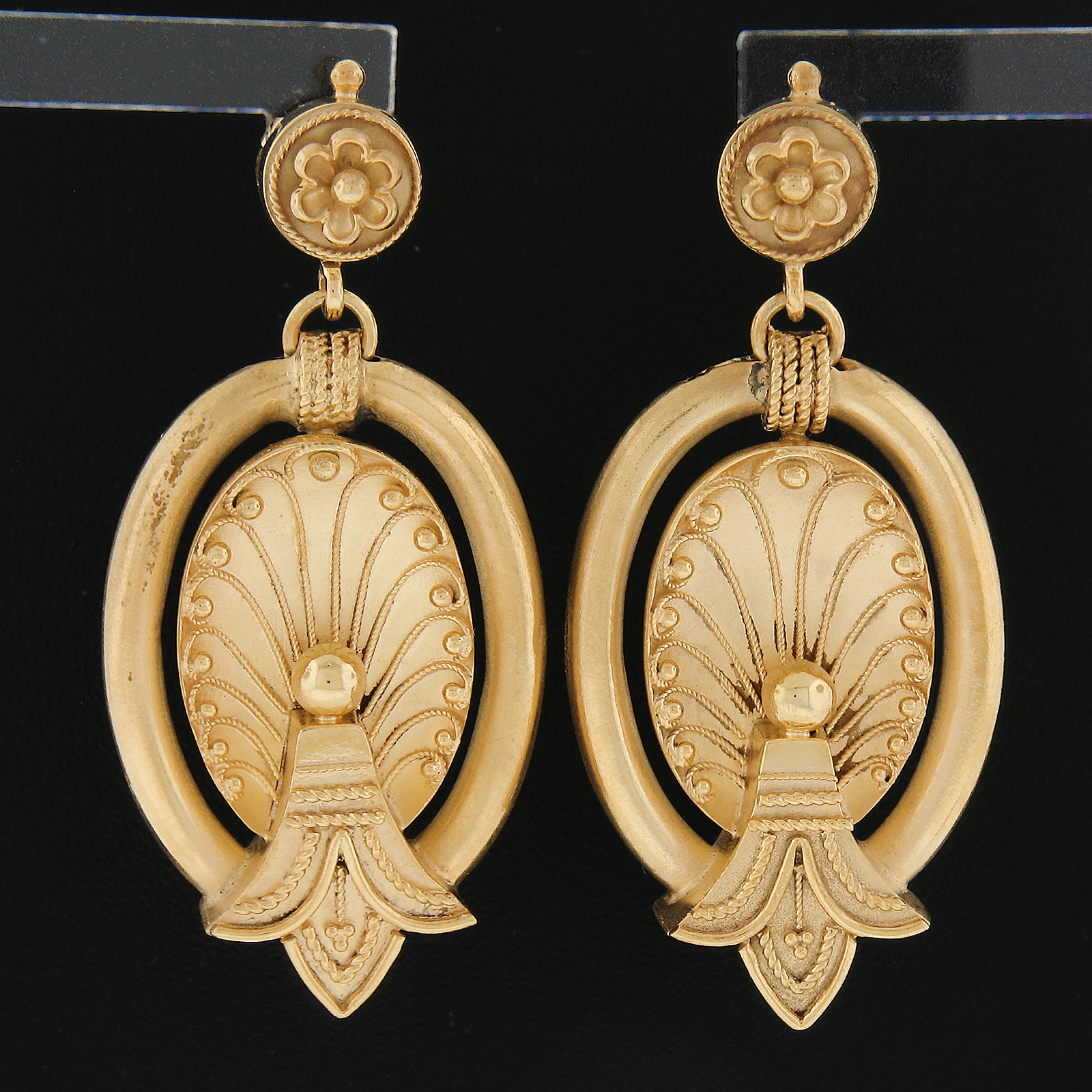 Material: Solid 18k Yellow Gold w/ Gold Wash (some old white solder marks in the back)
Weight: 9.20 Grams
Backing: Posts w/ Butterfly Closures (Pierced ears are required.)
Overall Width: 20.7mm (0.81