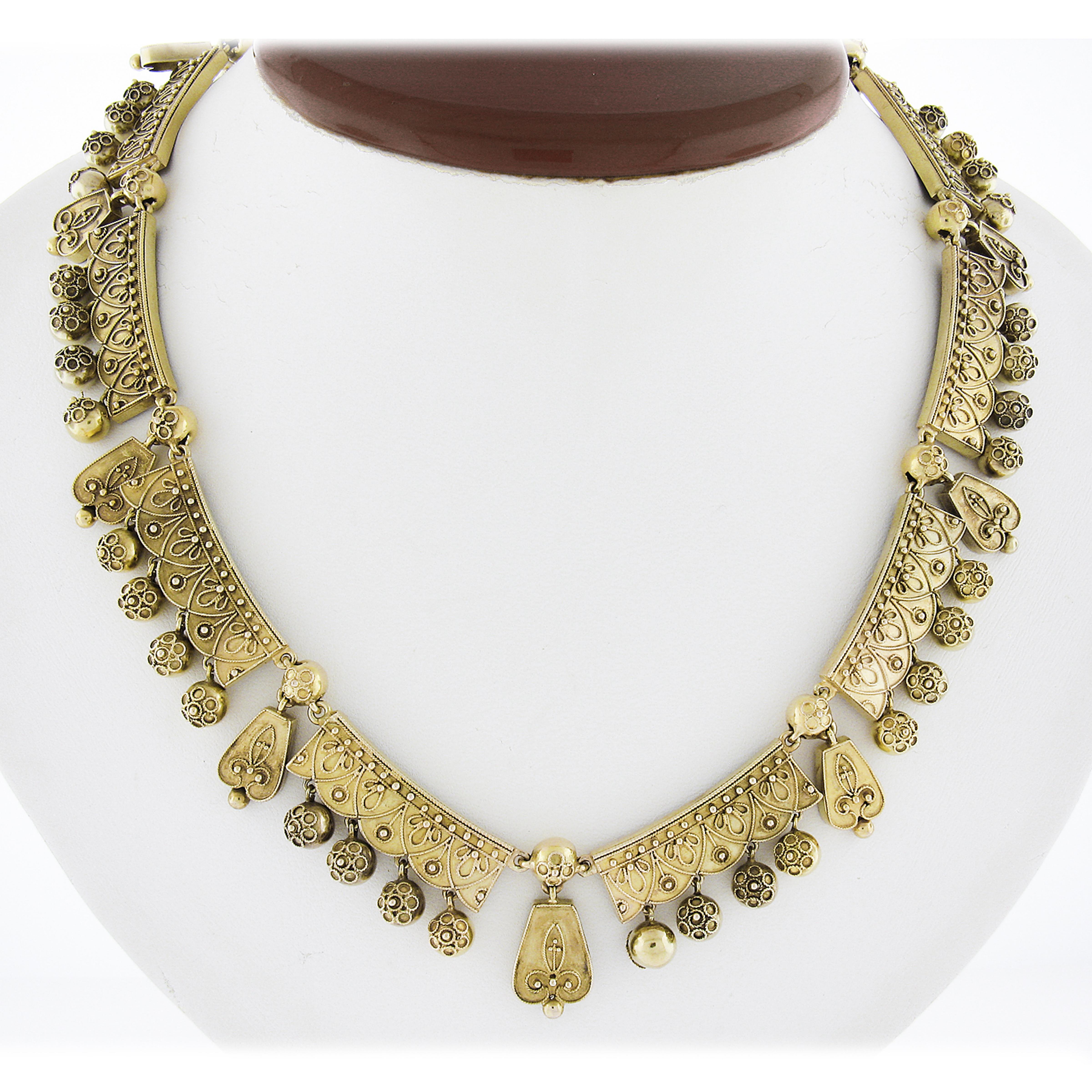Magnificent and rare Etruscan Revival Necklace. This necklace features Cannetille wire and beading work throughout. It has a swivel bail on the center front link giving the ability to hang your favorite pendant or whatever your heart desires! To