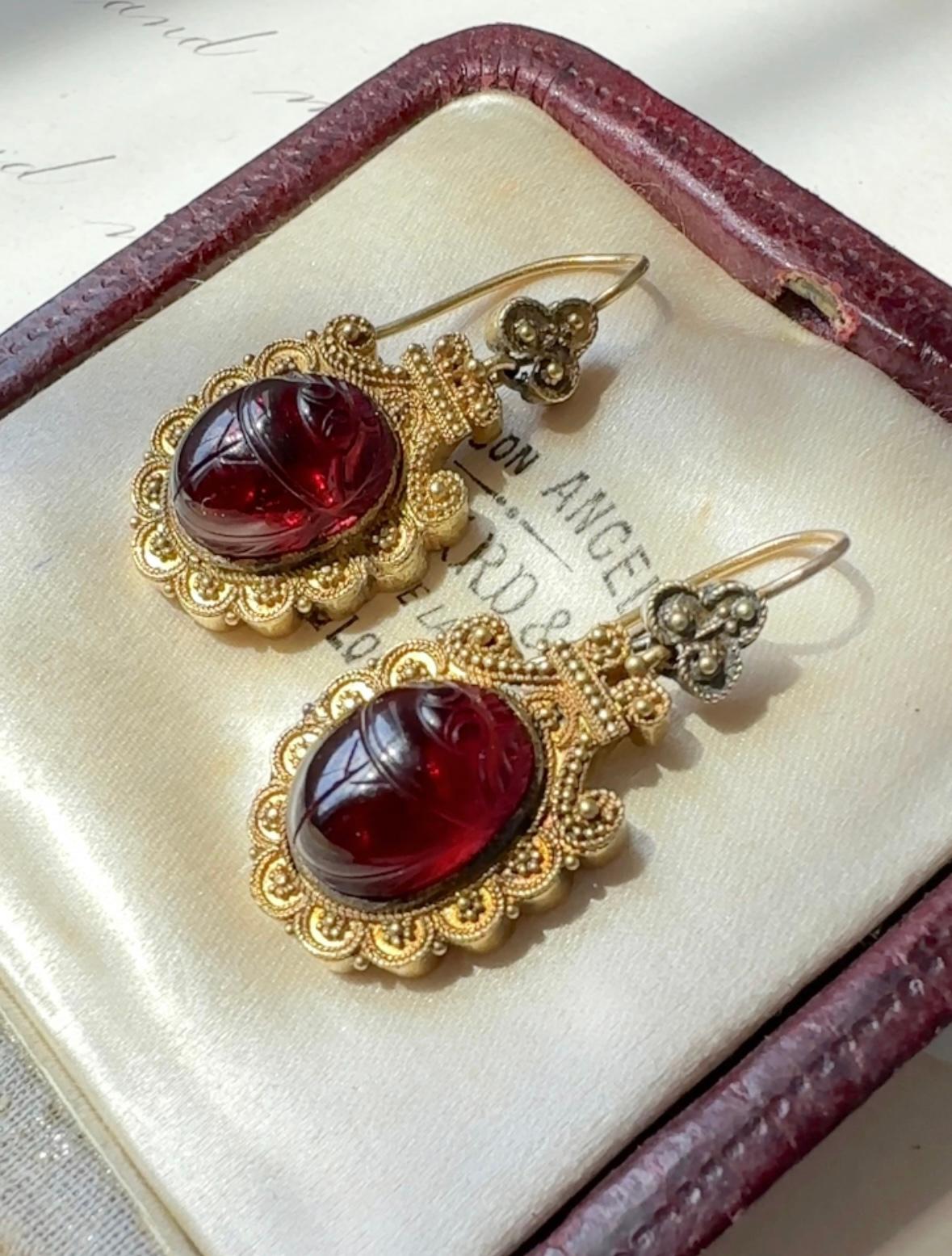 Egyptian themed jewelry became all the rage in the late 19th century after the opening of the Suez Canal in 1869. These delightful earrings feature glowing garnet scarabs mounted in warmly burnished 14k gold. Circa 1880. 

 

Symbolism: The scarab