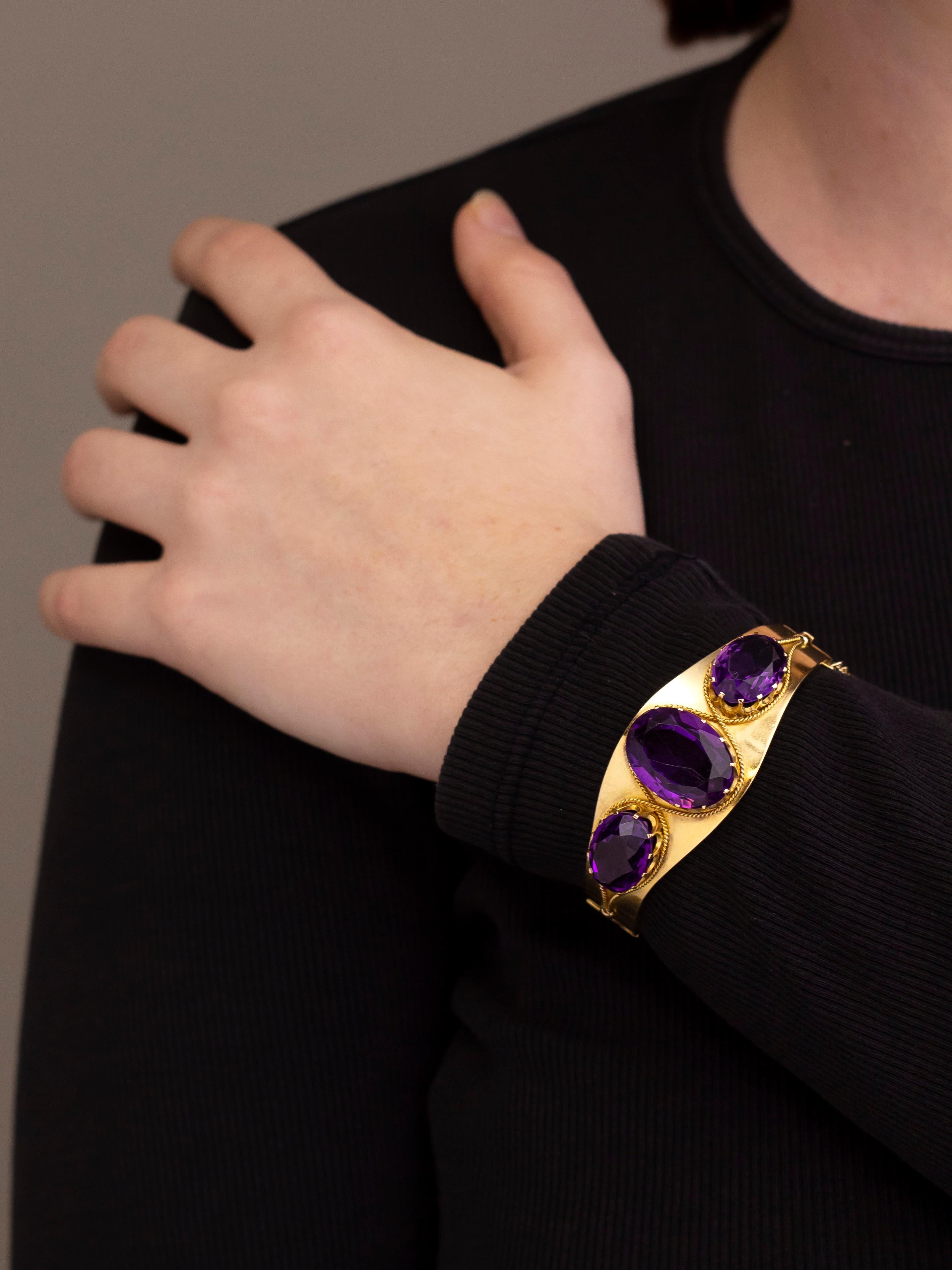 One of our favourite jewellery styles is Etruscan Revival, and this bangle is a lovely example of English jewellery from the last quarter of the 19th century. Crafted from 15 karat yellow gold the hinged oval bangle has been set to one side with