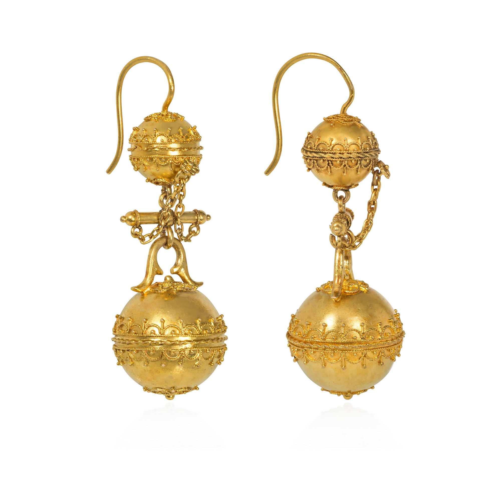 A pair of antique Victorian period gold pendant earrings in the Etruscan Revival style, comprised of gold beads with applied wirework and granulation suspended from similar bead surmounts with a baton spacer and chain decoration, in