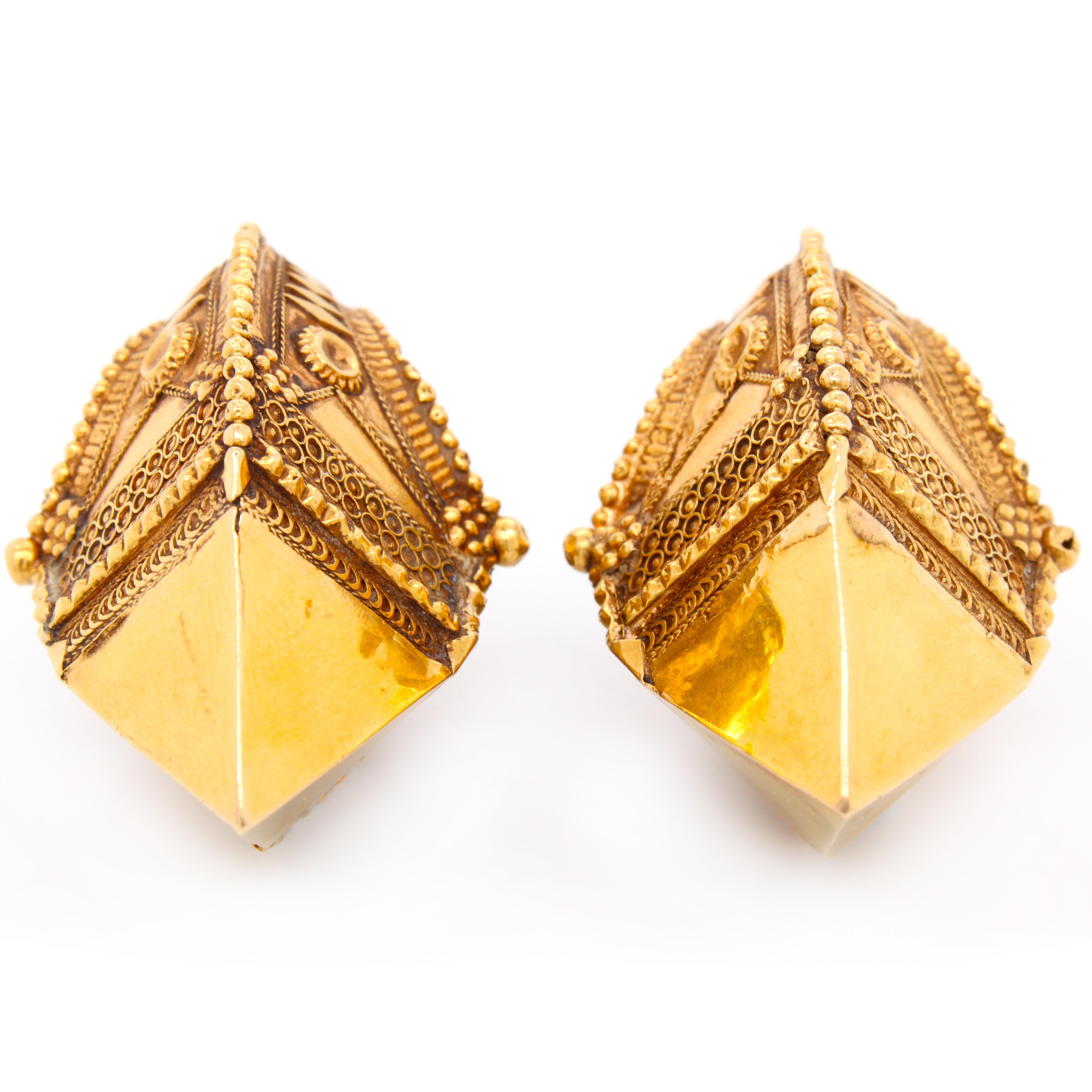 These big Etruscan Revival earrings are in 14k yellow gold and very finely worked. The geometric and floral design as well as reverse pyramidical shape at the bottom showcase the Etruscan Revival style. This came to prominence in Italy in the middle