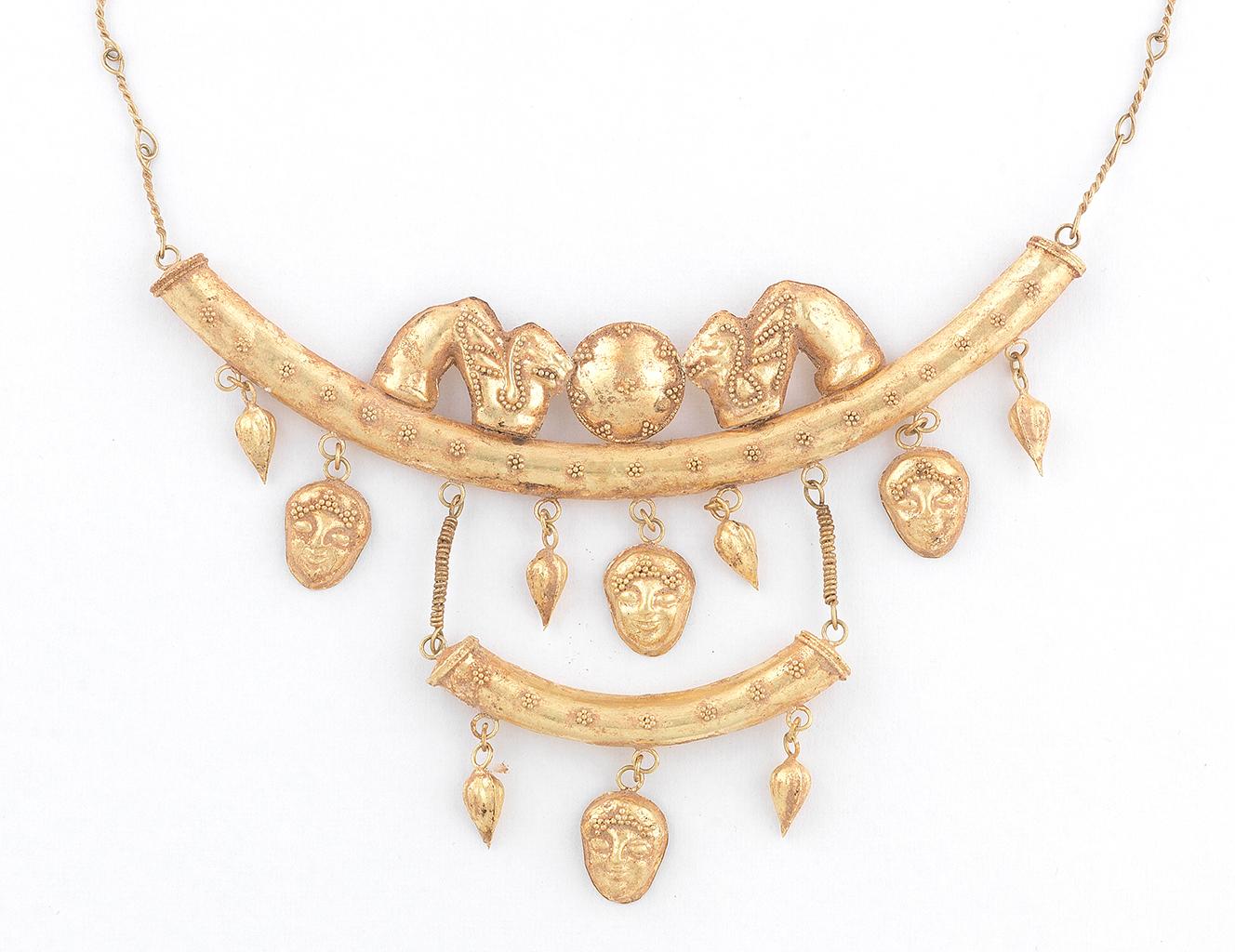 
Mythological figures and animals ropetwist decoration, mounted in gold, length 39cm 