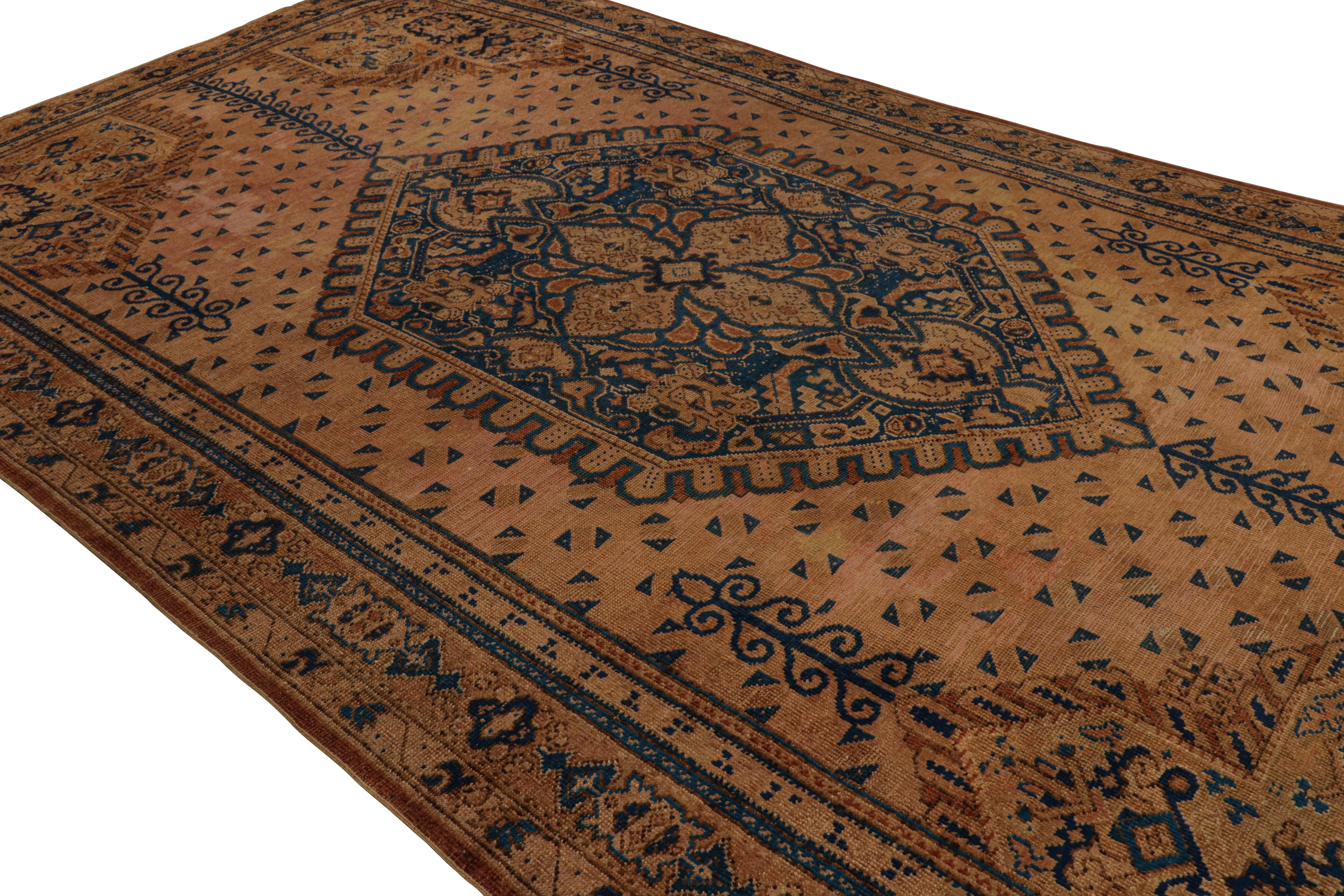 Hand-knotted in wool, this 11x20 oversized Antique European rug features a play of all-over and medallion style, with geometric patterns and a large central floral medallion in navy blue. 

On the Design: 

Admirers of the craft may note this