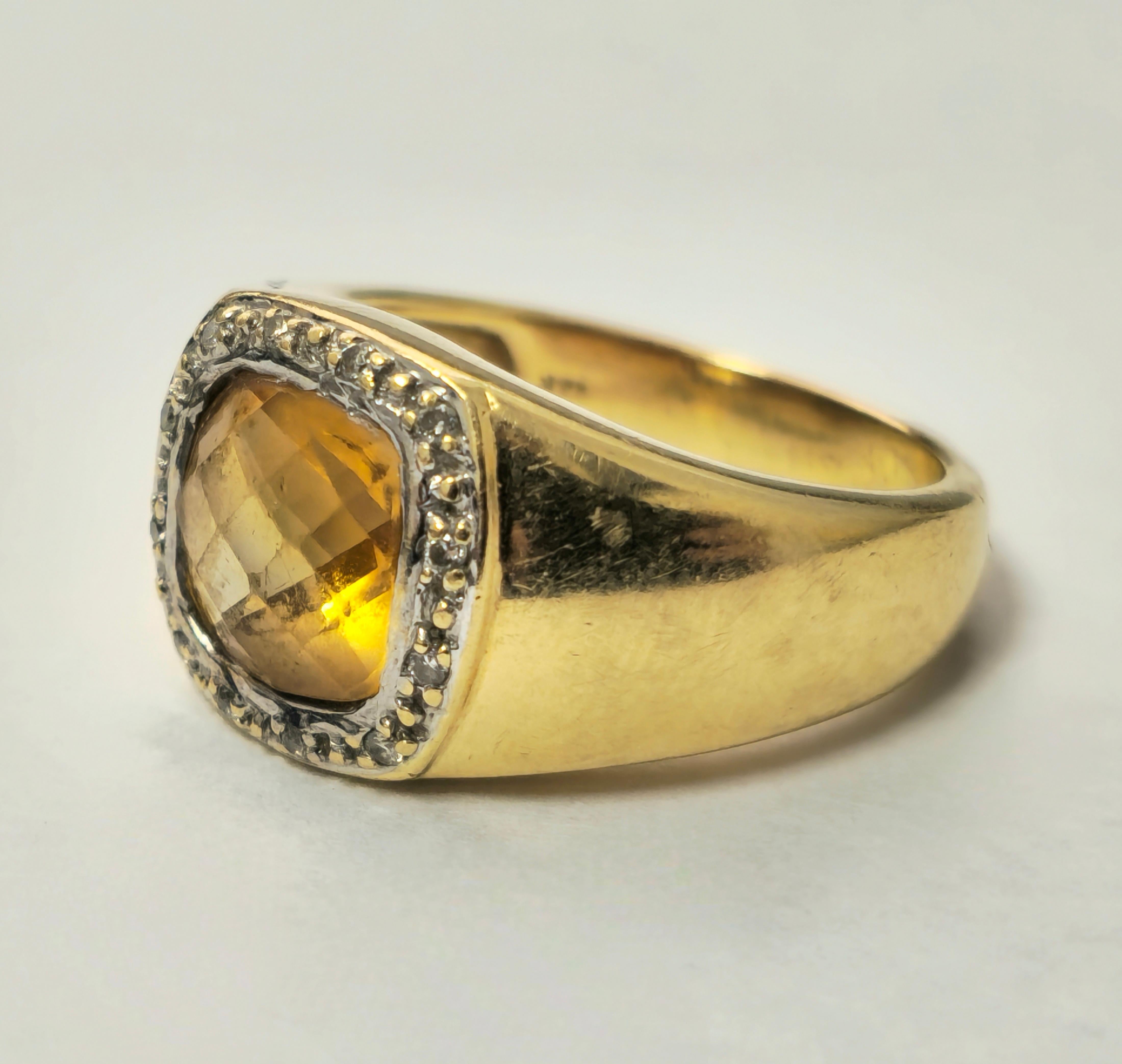Fashioned from radiant 14k yellow gold, this exquisite ring features a mesmerizing centerpiece: a 4.90 carat yellow citrine, sourced directly from the earth, exuding warmth and elegance. Accompanying this stunning citrine are round-cut diamonds