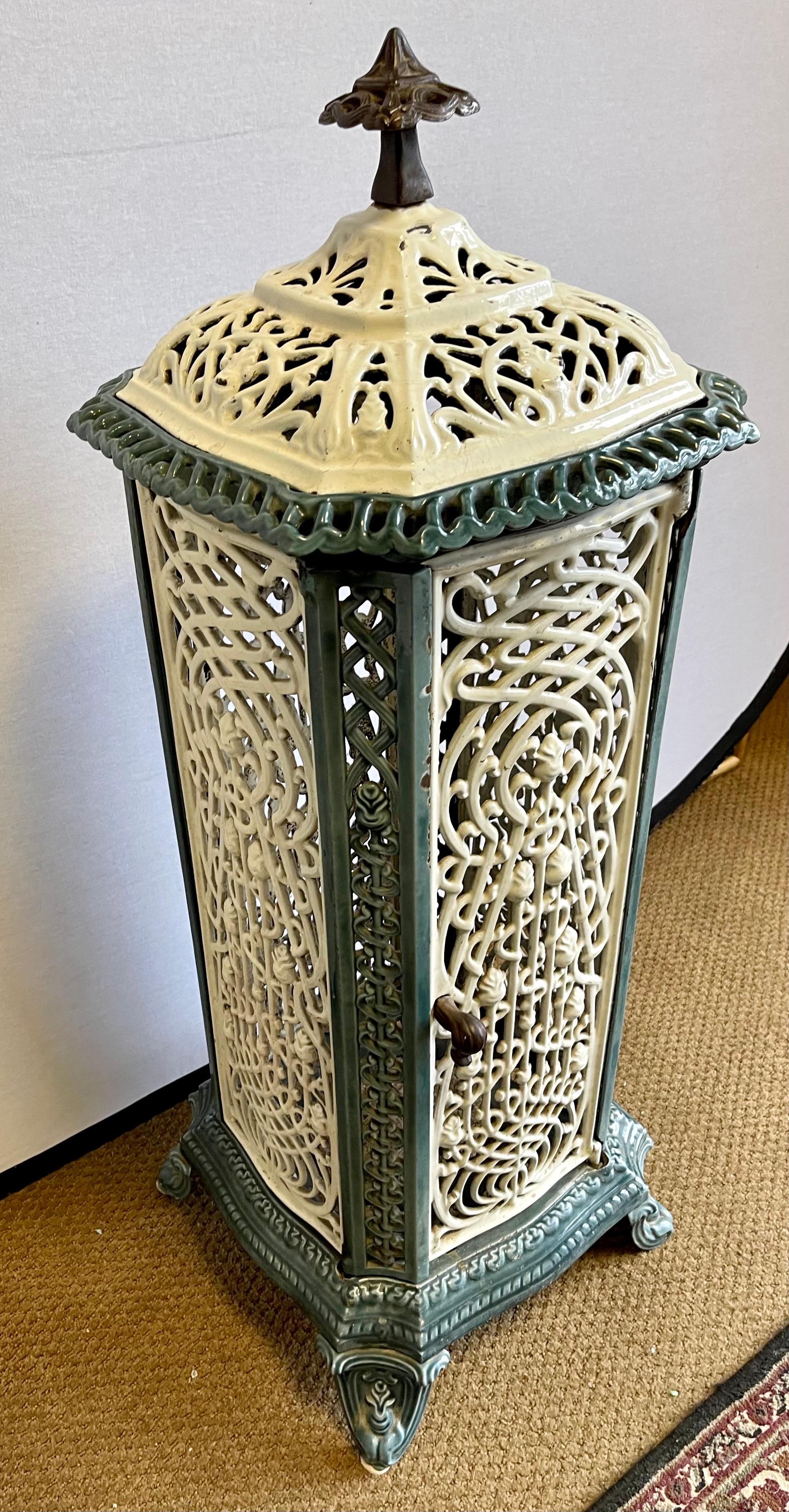 A rare Belgian heater made of cast iron, enamel and porcelain. Iconic European art nouveau. Heavy, with a weight of 70 lbs. Age appropriate wear. Please see all pictures.
