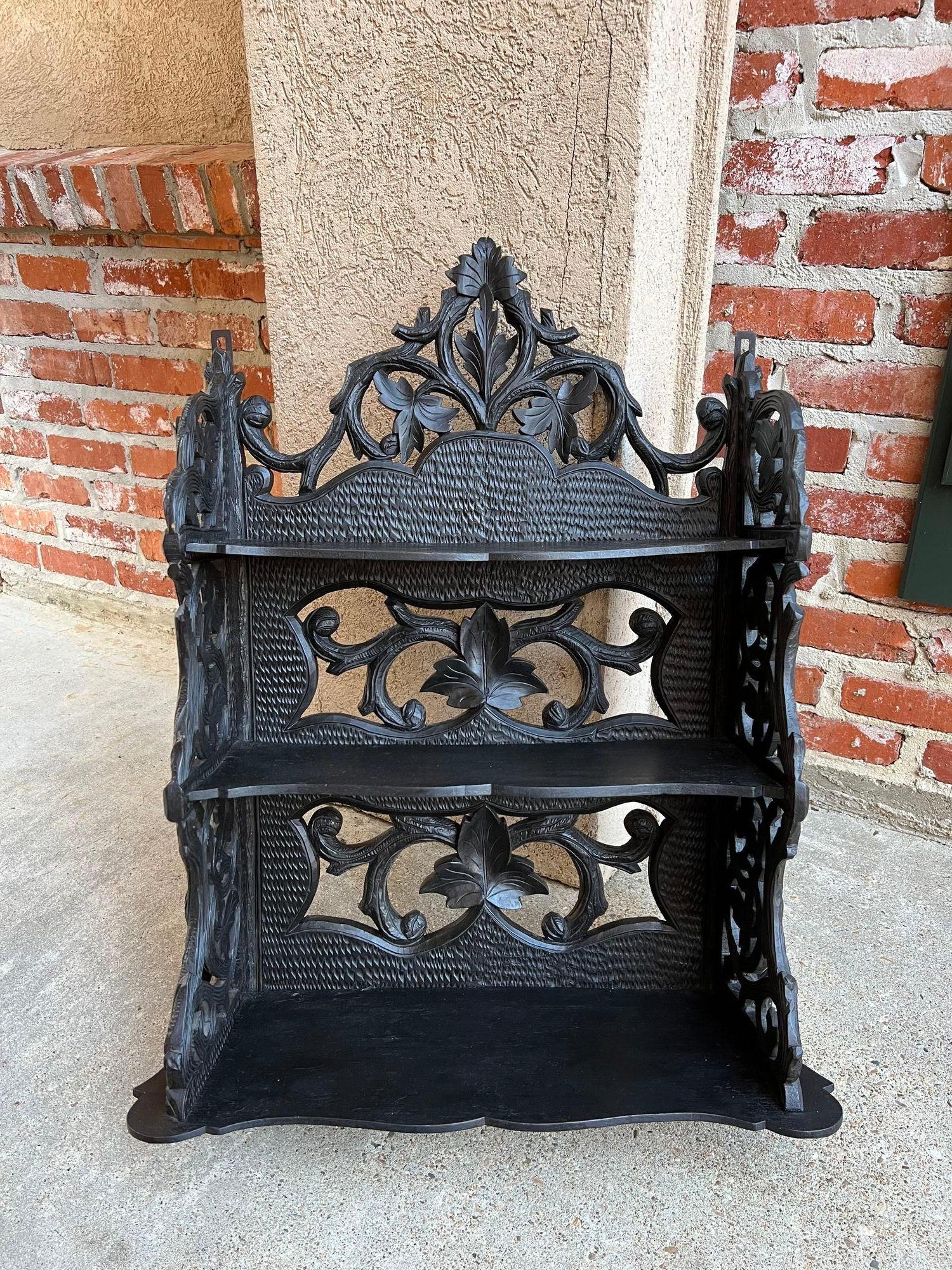 Antique European Black Forest Carved Wall Shelf Plate Display Rack German.

 Direct from Europe (and one of our favorite finds), this stunning Black Forest carved wall shelf/display rack. Elaborate hand carvings throughout, with a high upper crown