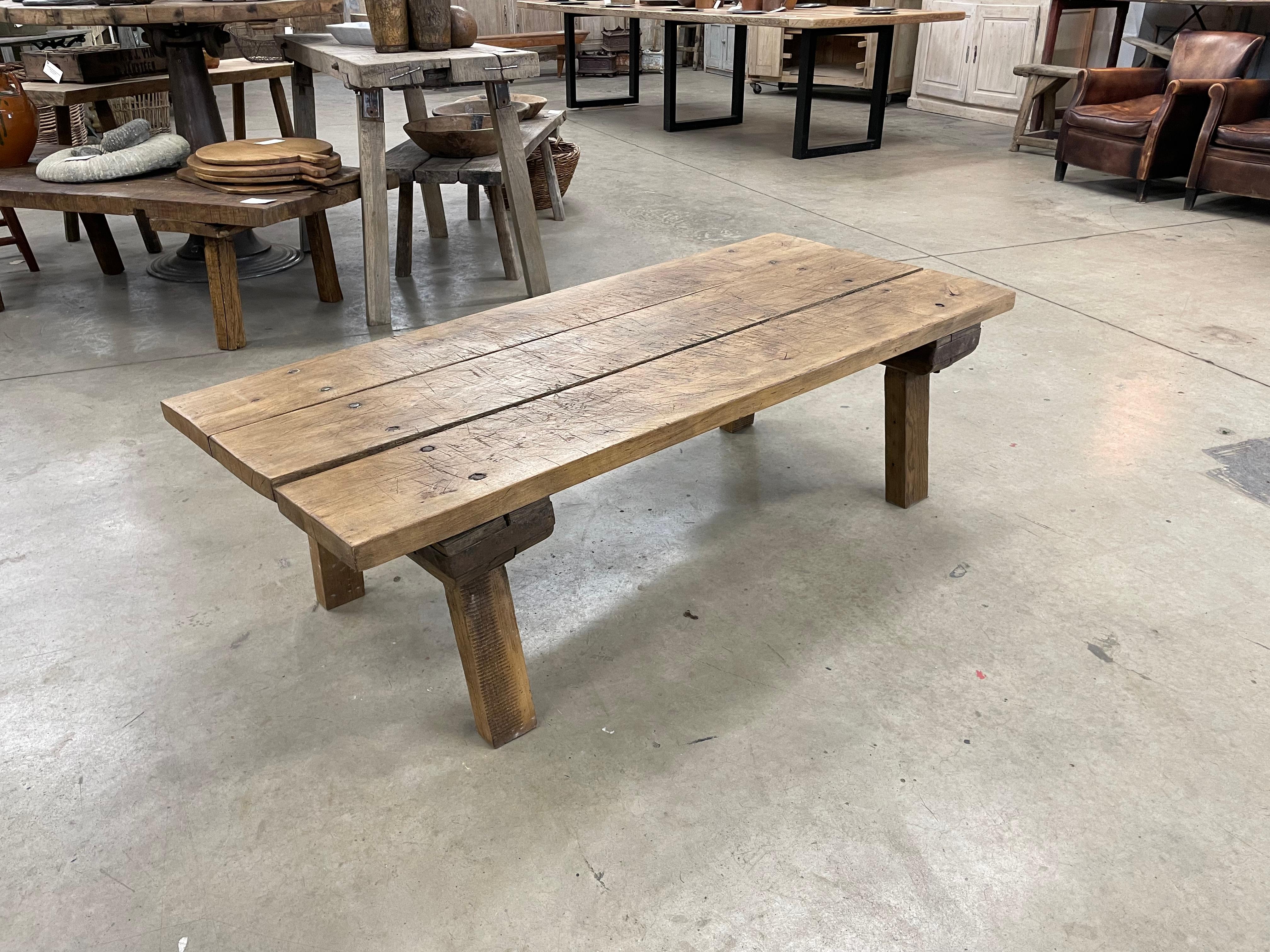 Antique Hungarian primitive gnarly butcher block rustic farmhouse table reduced to coffee table height.

The 3 plank chunky top with all its imperfections of decades of use, sits on 4 simple splayed legs. A perfect wabi sabi addition to the home.