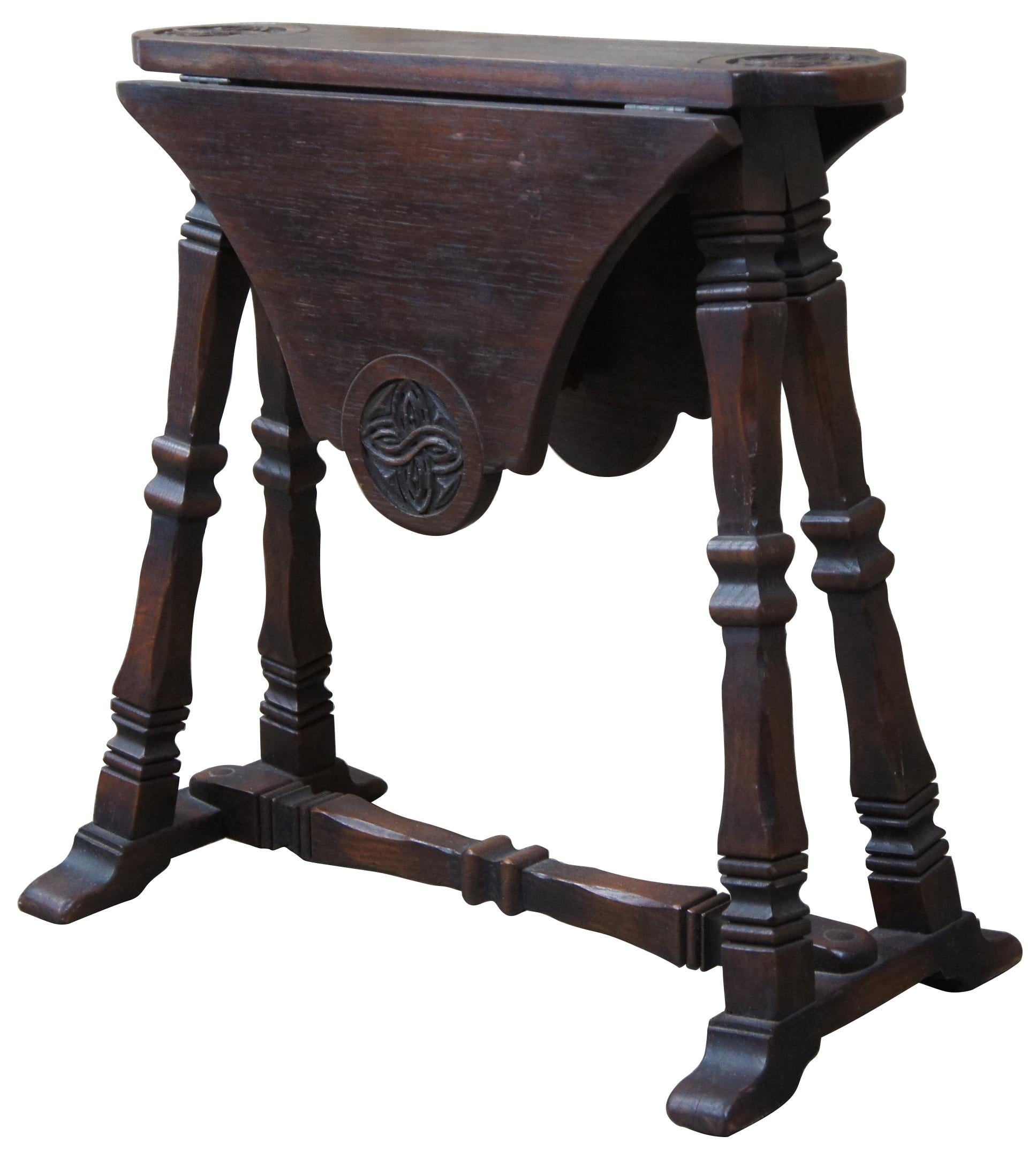 Early 20th century European (English or Irish) drop-leaf table. Made from oak with carved Celtic knots along the top. The petite design makes it perfect for use as an end table.

 Leaves add 11