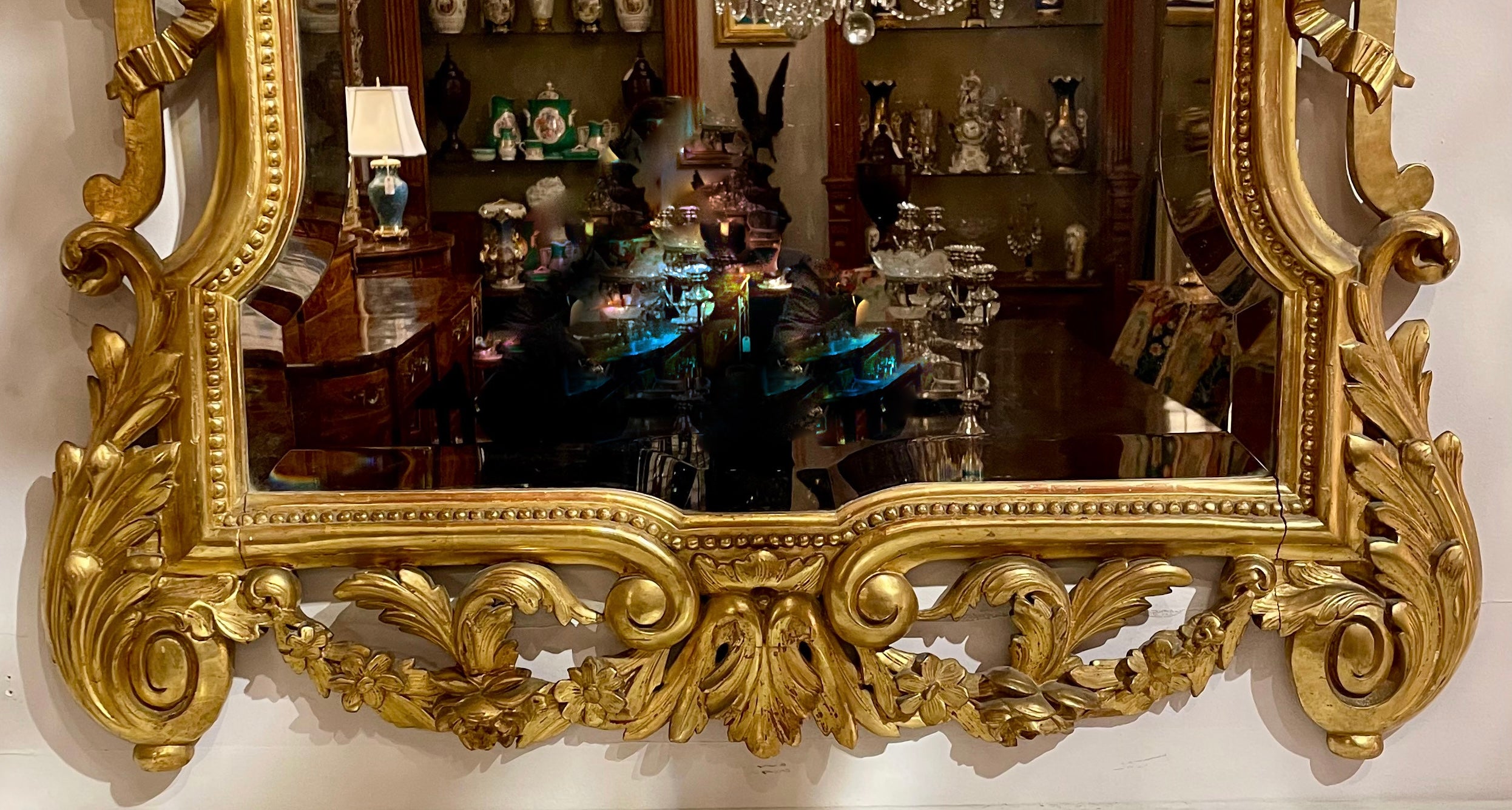 Antique European Carved Wood with Gold Leaf Beveled Mirror, Circa 1880.
