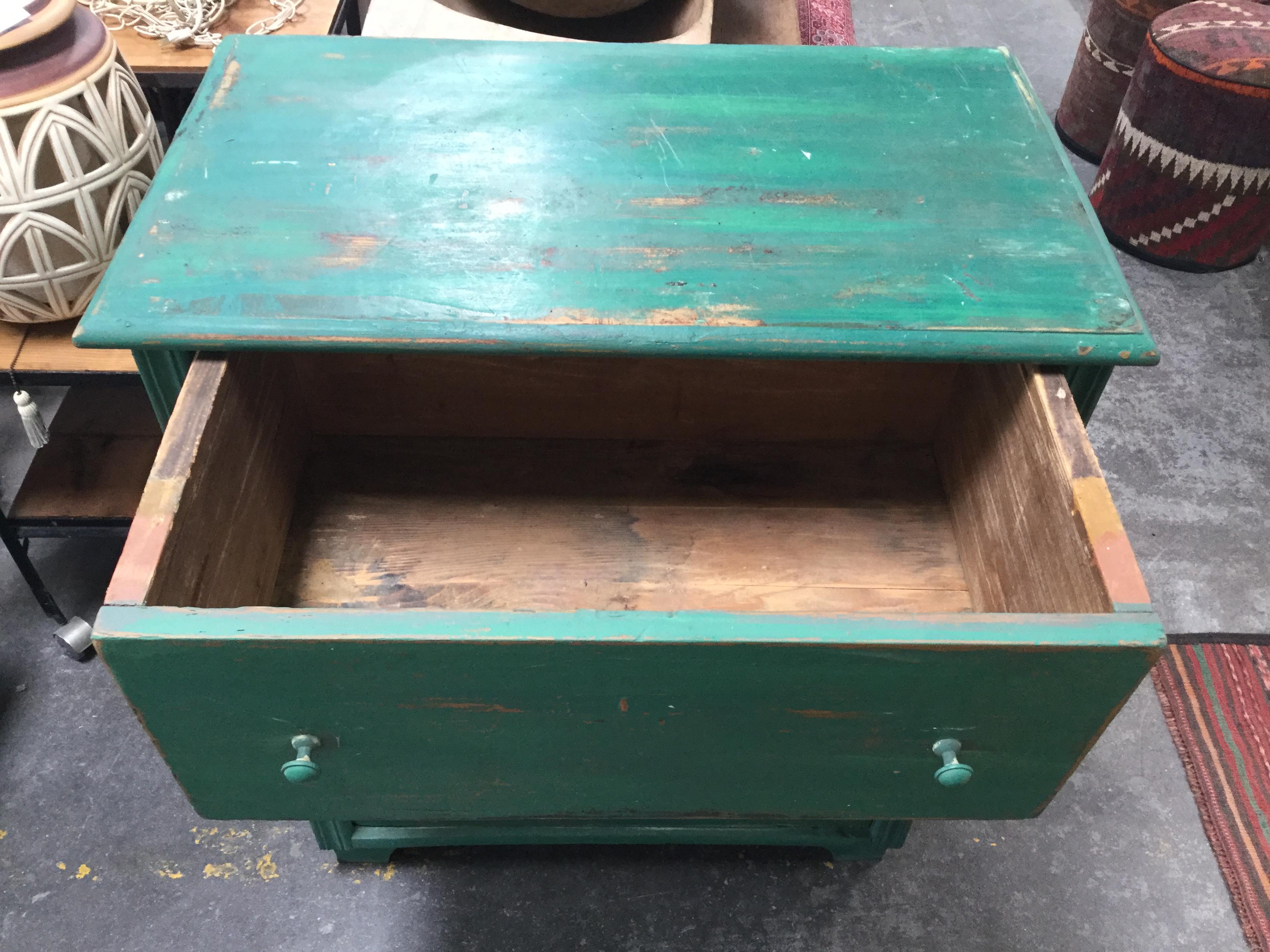 Give a drab corner a charming pop of color, with this gracefully green gem. Plenty of chipped and worn-away charm, with original key as pictured. 
Drawer inner dimensions measure 24.5