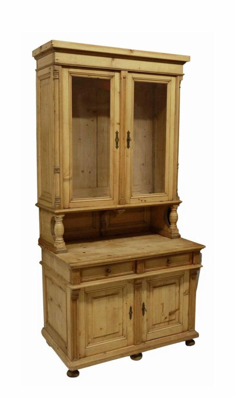 An antique European country farmhouse stripped pine stepback glazed door cabinet hutch / buffet / kitchen cupboard. 
Circa 1900

Handmade in Continental Europe in the early 20th century, crafted of solid pine wood, three-piece design, the upper