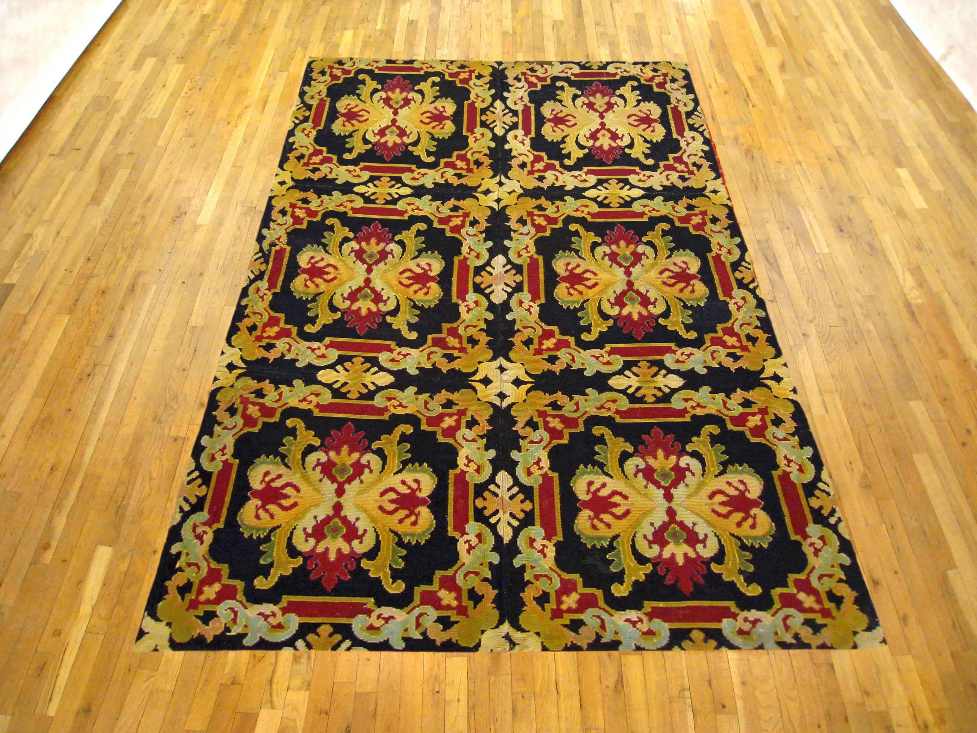 An antique European decorative needlepoint carpet, circa 1890, size 6'9