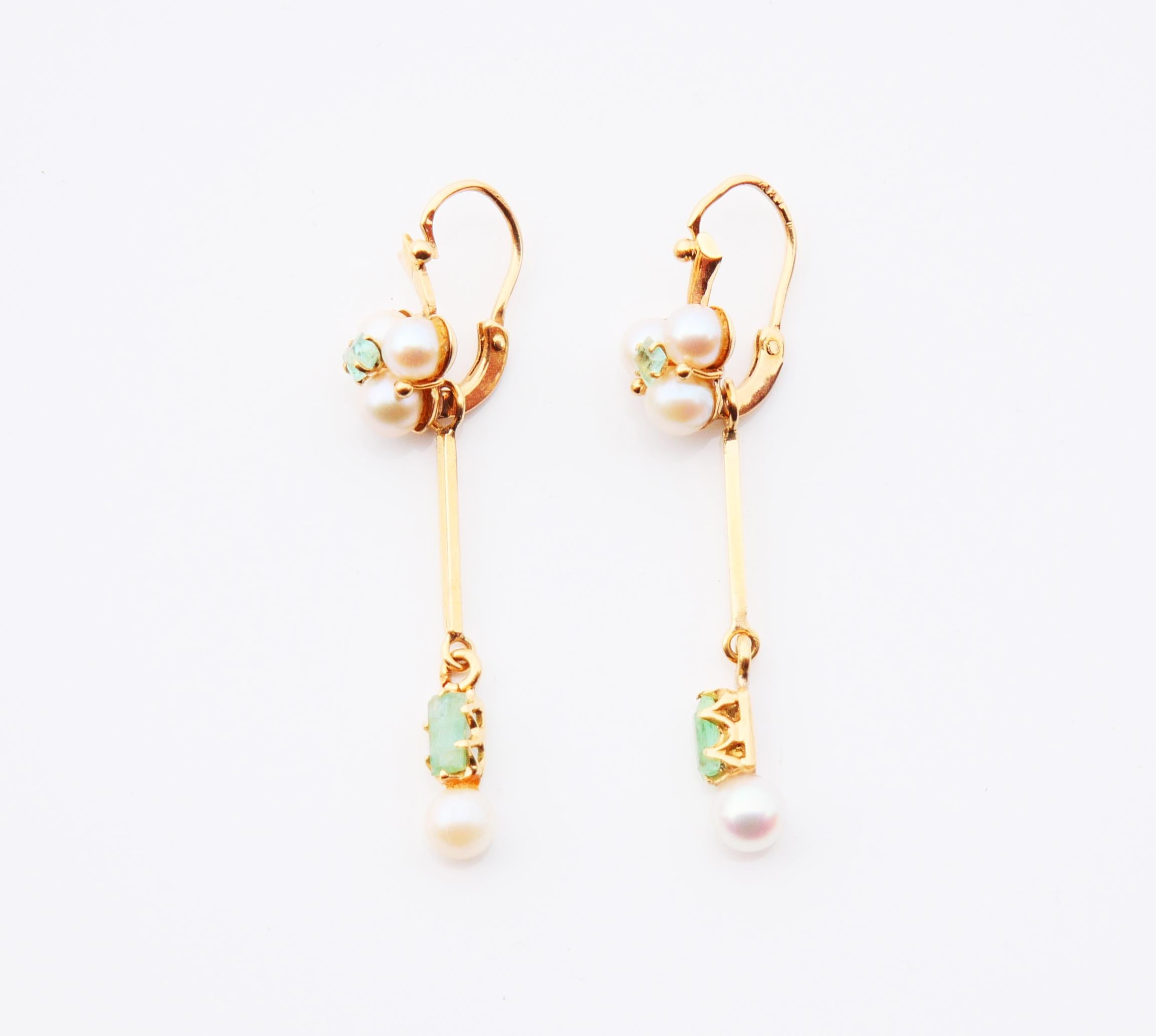 A pair of dangles with folding hooks in 18K Yellow Gold decorated with natural Emeralds and cultured Pearls settings. Removable pendants are nice add-ons that can also be used combined with other earrings you may have or can be converted into a