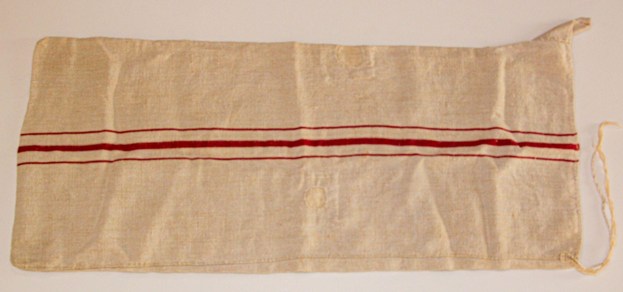 Antique European French long grain sack homespun linen fabric with red striped.
A large grain bag made of a narrow woven length of homespun linen that was folded over and hand-stitched along the long sides.
Antique grain sack, handwoven and hand