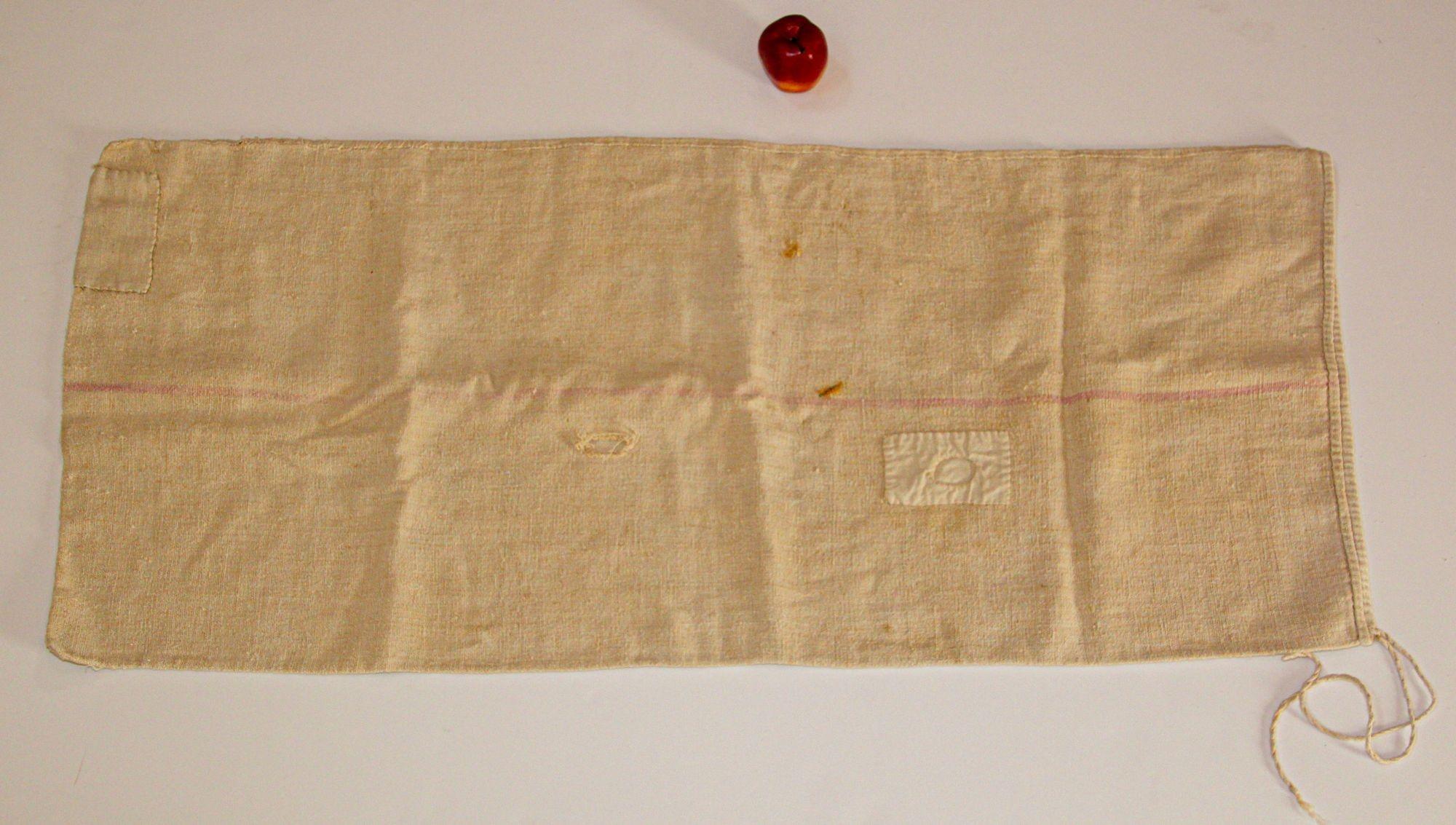 Antique European French long grain sack homespun linen organic fabric.
A large grain bag made of a narrow woven length of homespun linen that was folded over and hand-stitched along the long sides.
Antique grain sack, handwoven and hand loomed