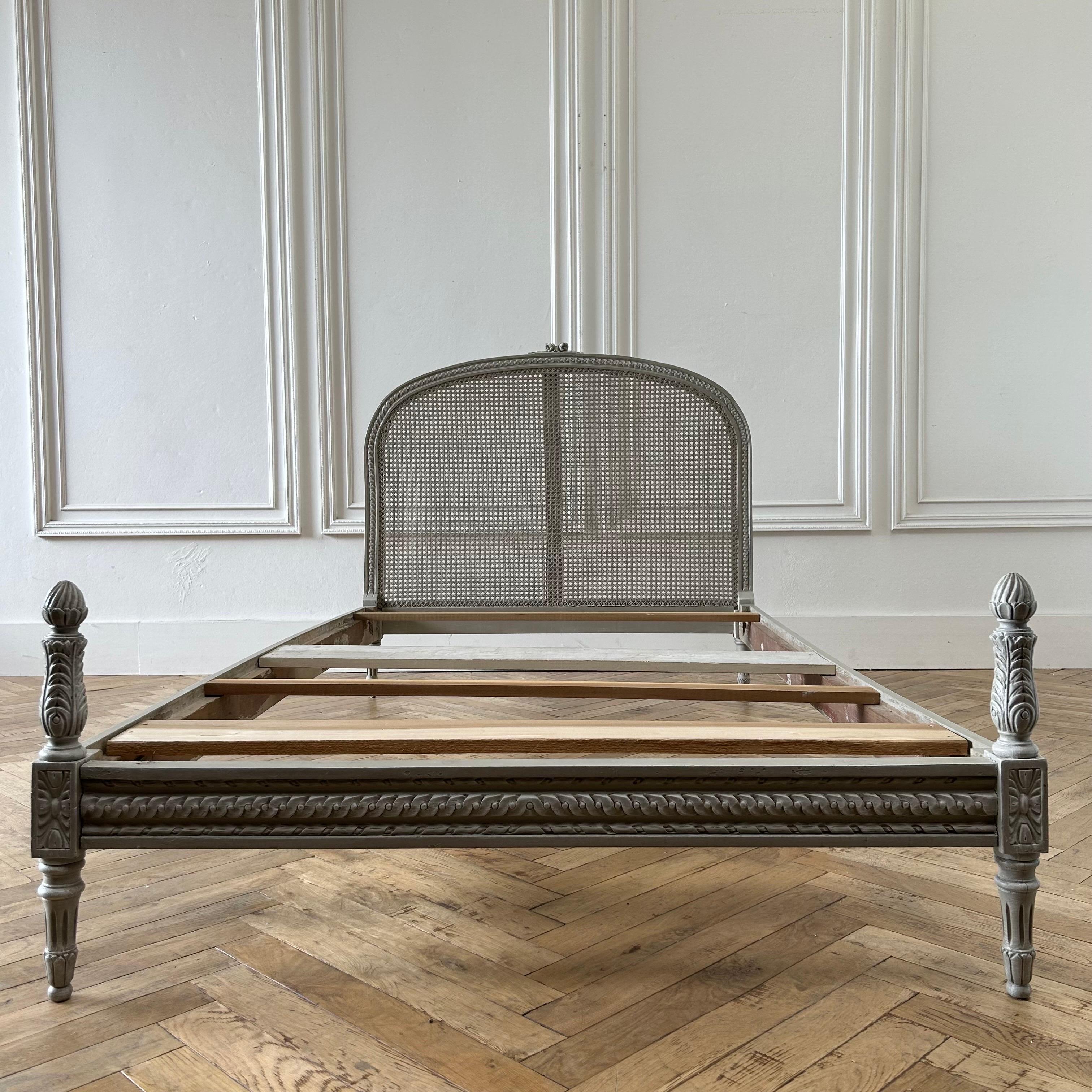Antique cane bed 47”w x 82”d x 43”h Footboard:20”h 
Inside: 45”w x 78”d
Painted in a french dove gray, with beautiful carved roses, and french cane headboard.
Solid and sturdy ready for daily use. 
This is a european full size, it requires a