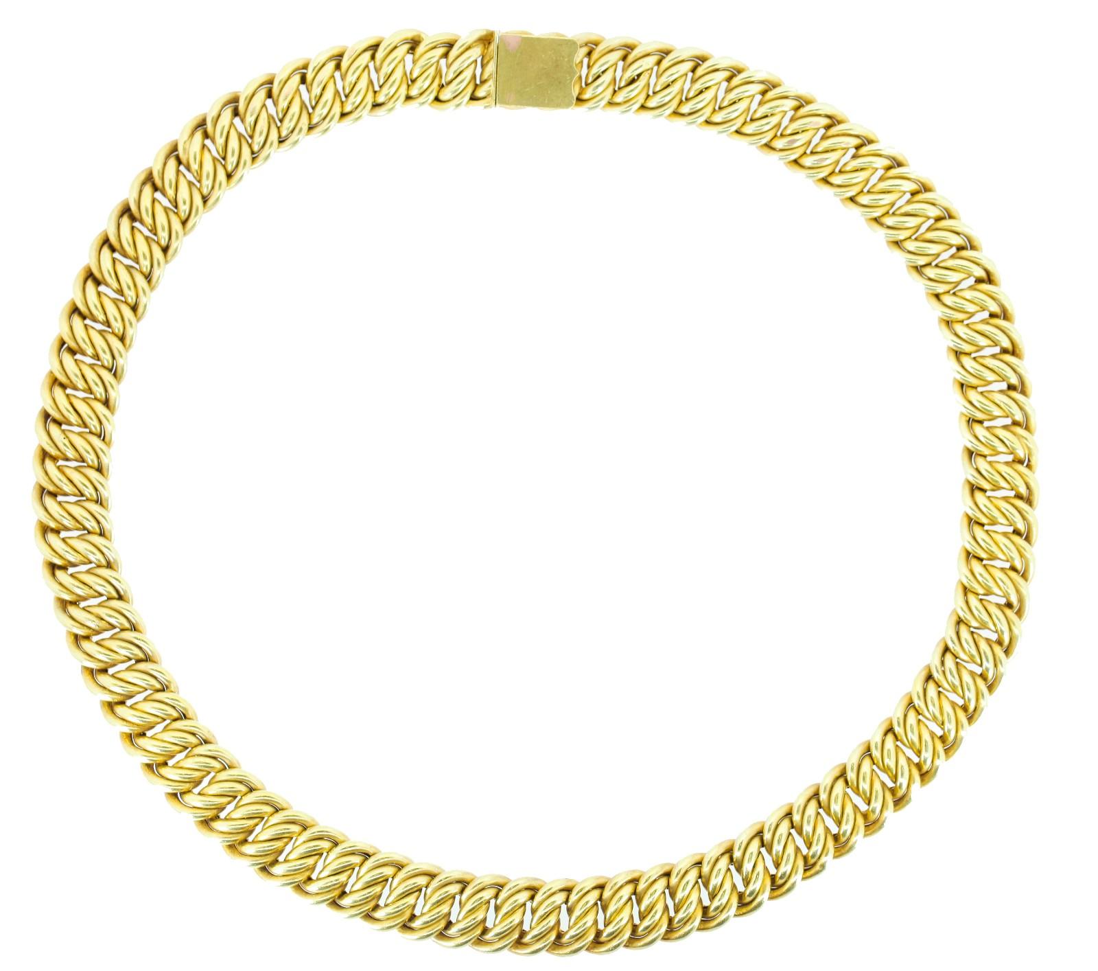 This beautiful 1940s necklace is created of 560 content yellow gold (13.45KT), indicating European origin.  The half inch wide intertwined links feature a delicate swirl and dimple embossing.  Quite special, the 18 inch long necklace feels