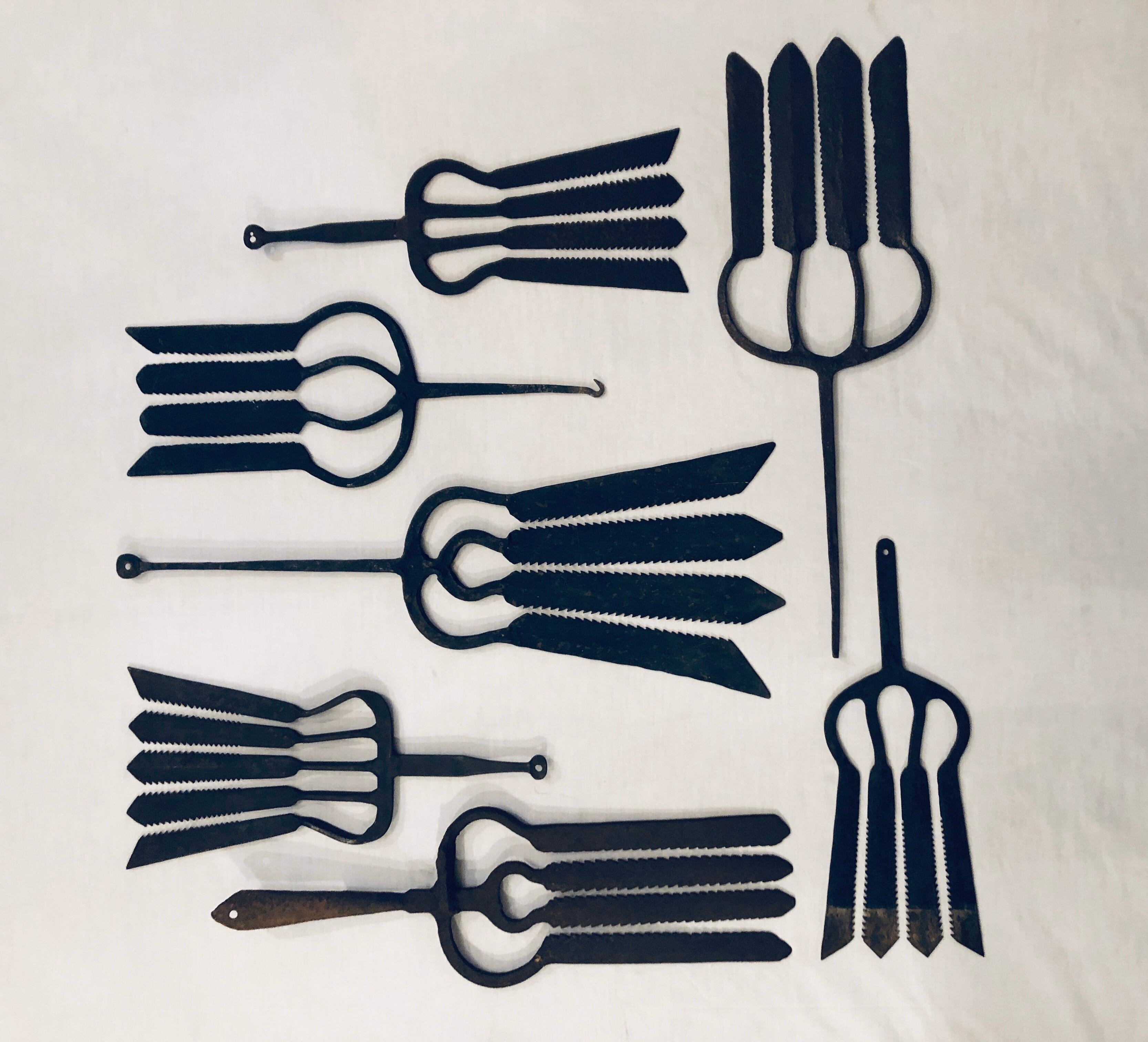 A collection of 7 rare late 19th and early 20th century European hand forged eel spears ranging is size from 15 1/4