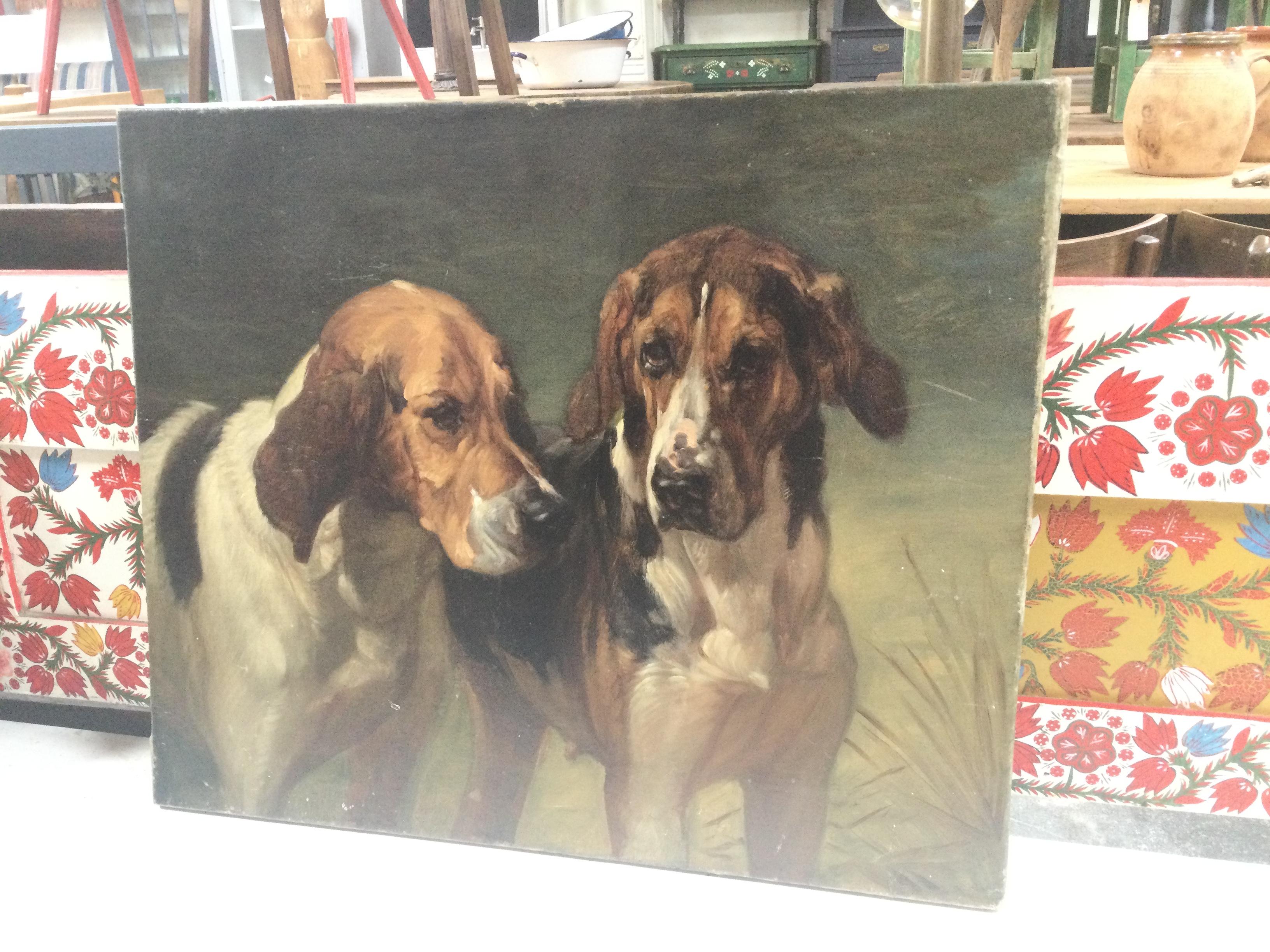 This vintage oil painting is originally from Europe and features the subject of two dogs.