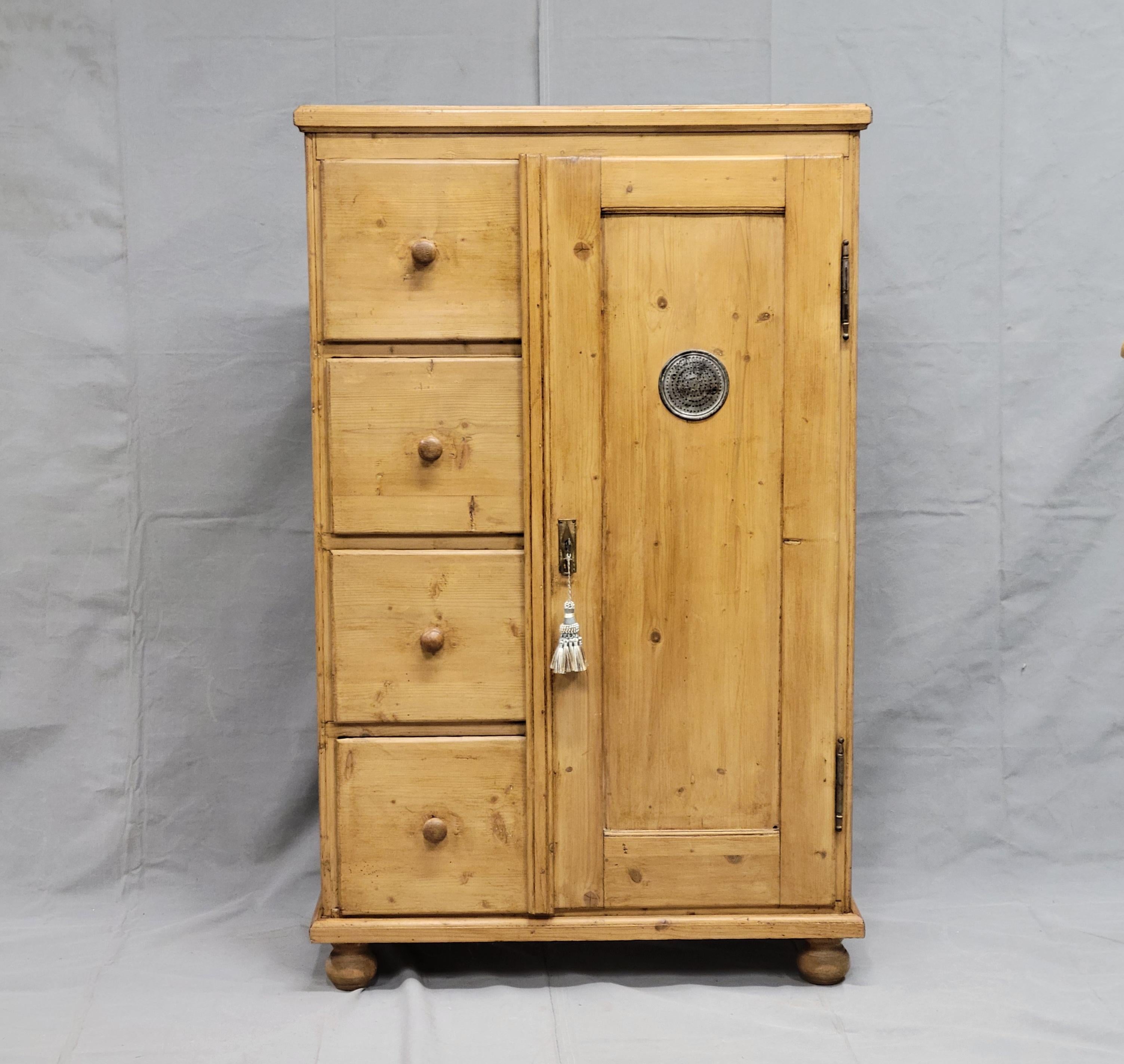 A beautiful, rustic antique pine larder or pie cabinet cupboard that dates from the late 1800s in Eastern Europe (Germany / Czech Republic / Slovakia). These cabinets were used in kitchens prior to refrigeration. It is in good condition for its age