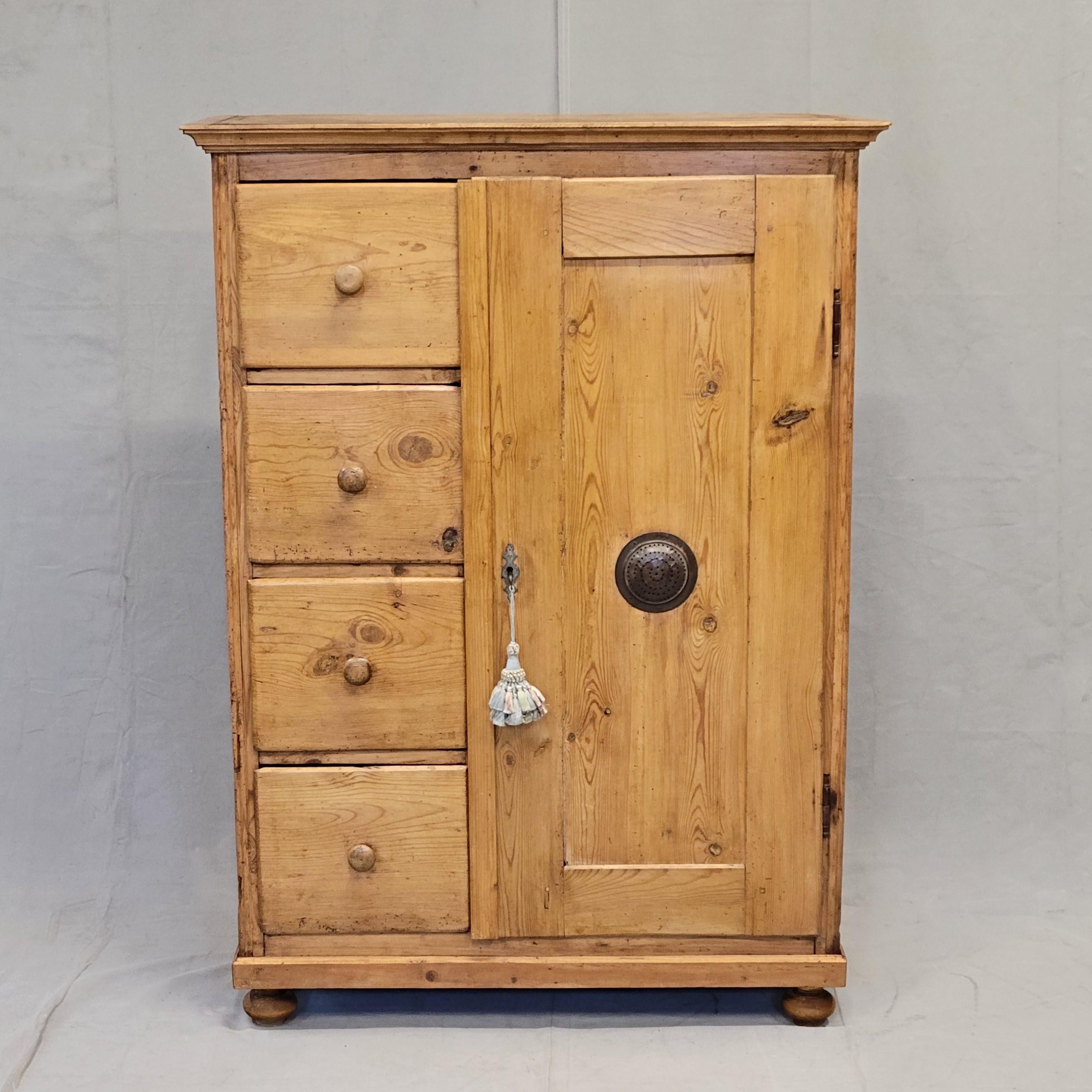 A beautiful, rustic antique pine larder or pie cabinet cupboard that dates from the late 1800s in  the Czech Republic. These cabinets were used in kitchens throughout eastern Europe, for food storage. It is in good condition for its age and has