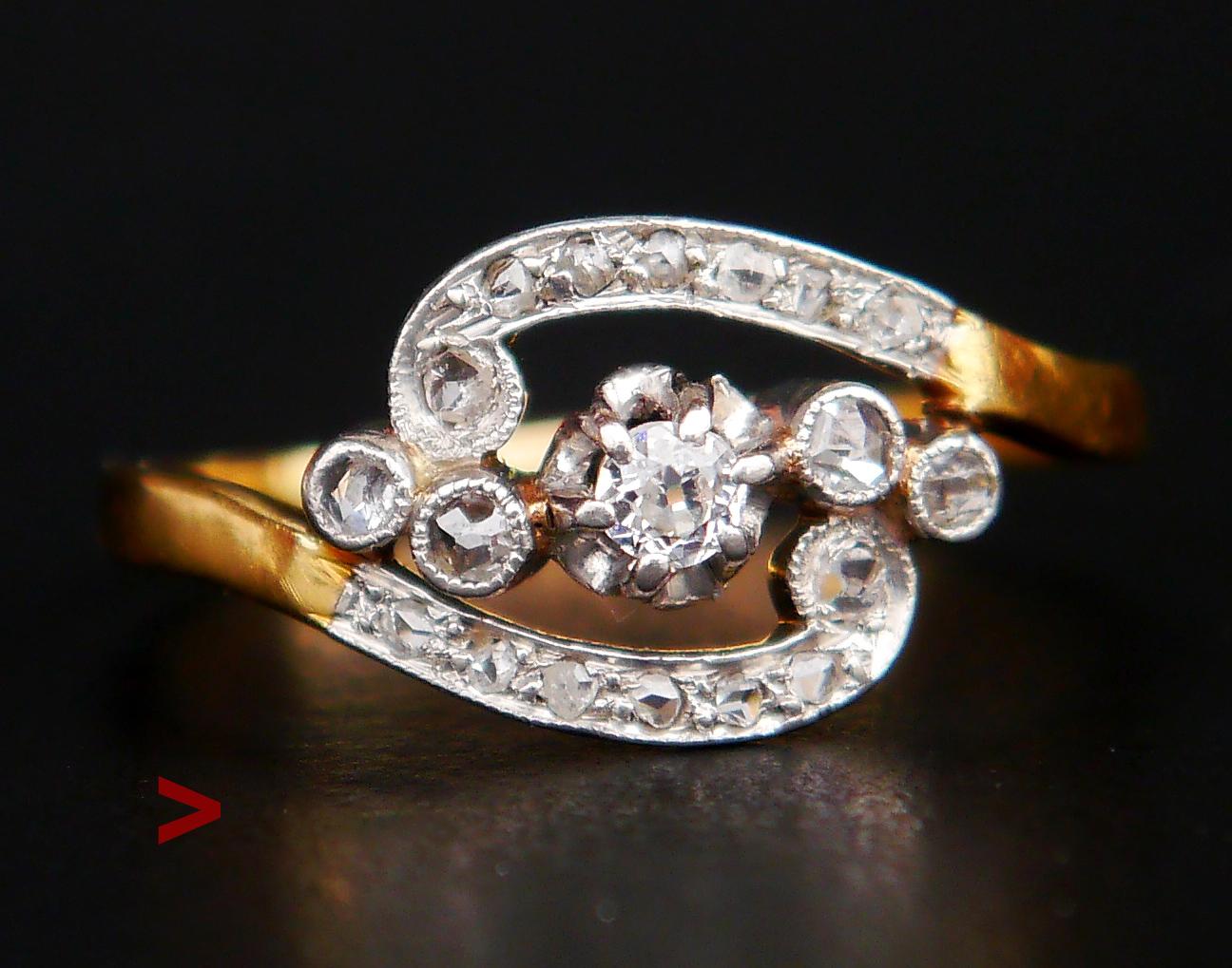 Beautiful Antique Ring featuring intricate design in solid Yellow and Platinum with one old European cut and 18 rose cut Diamonds.

The Crown has inter-twisting bands with a top in Platinum adorned with pave set diamonds . All stones have their open