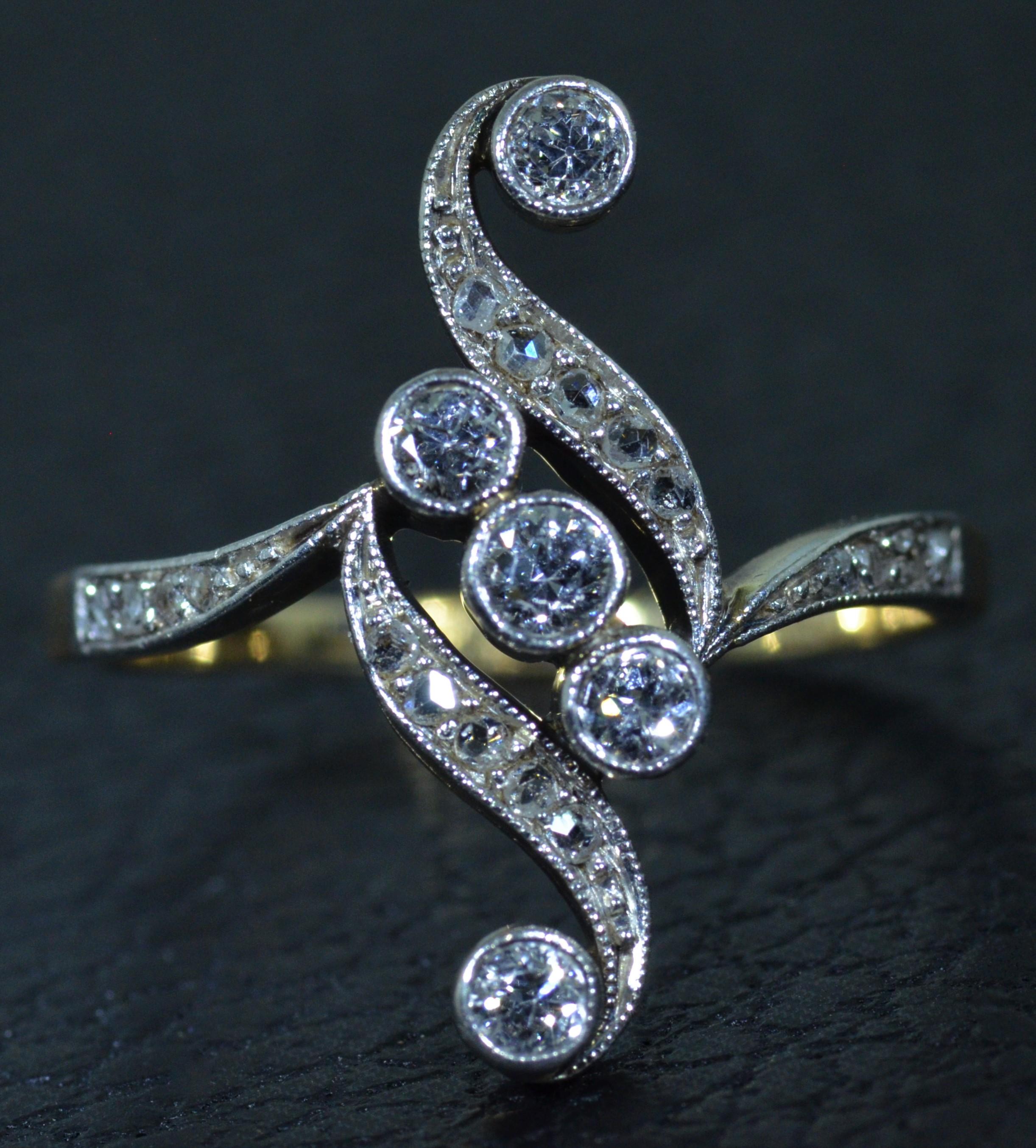 Ladies original antique ring from a European estate set with old mine cut diamonds and Rose cut diamonds throughout!