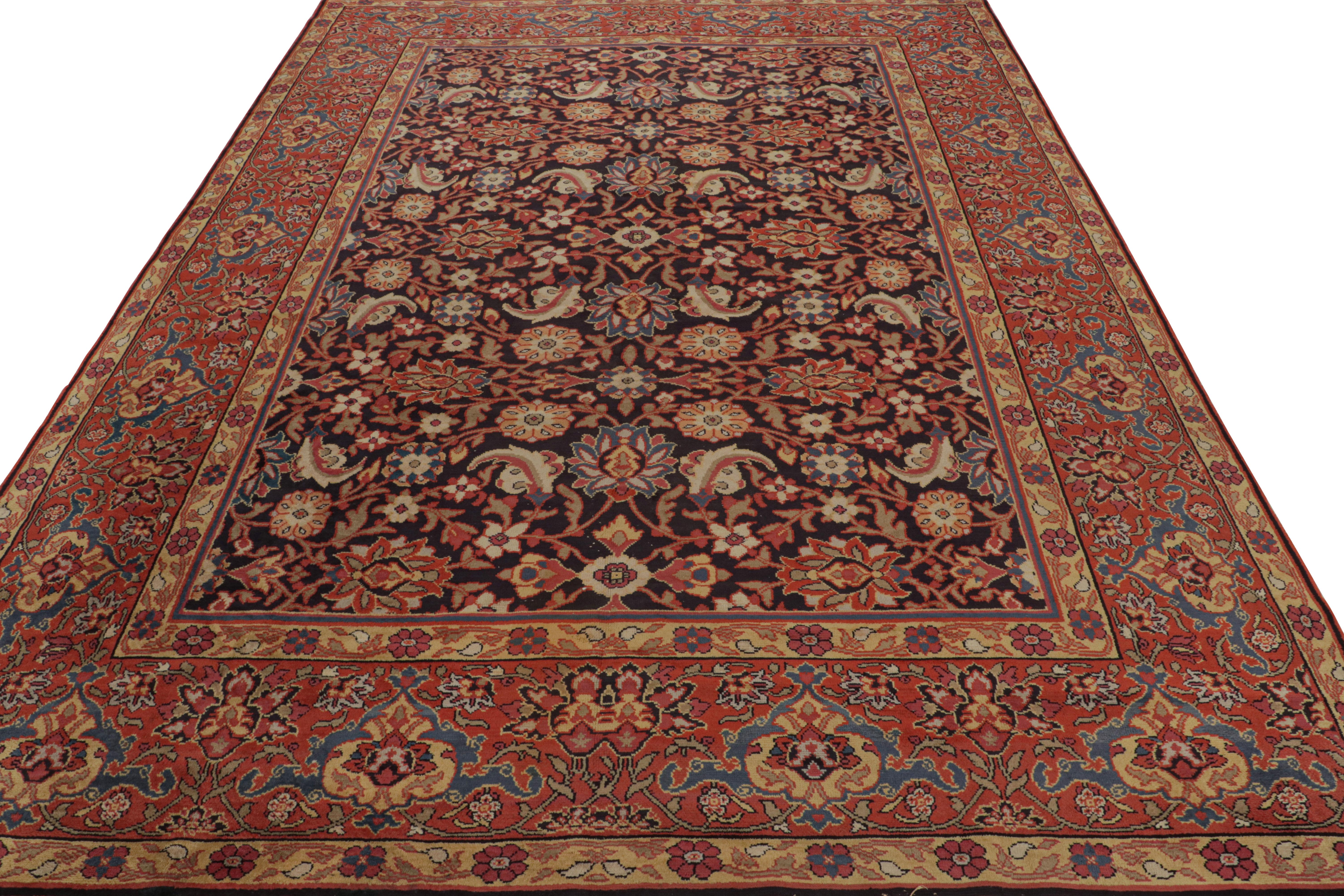 Hand-knotted in wool, an antique 8x11 European rug originating from Ireland circa 1920-1930 - inspired by Persian rugs of the same and preceding periods

On the Design:

The design enjoys a black field and red border alike underscoring floral