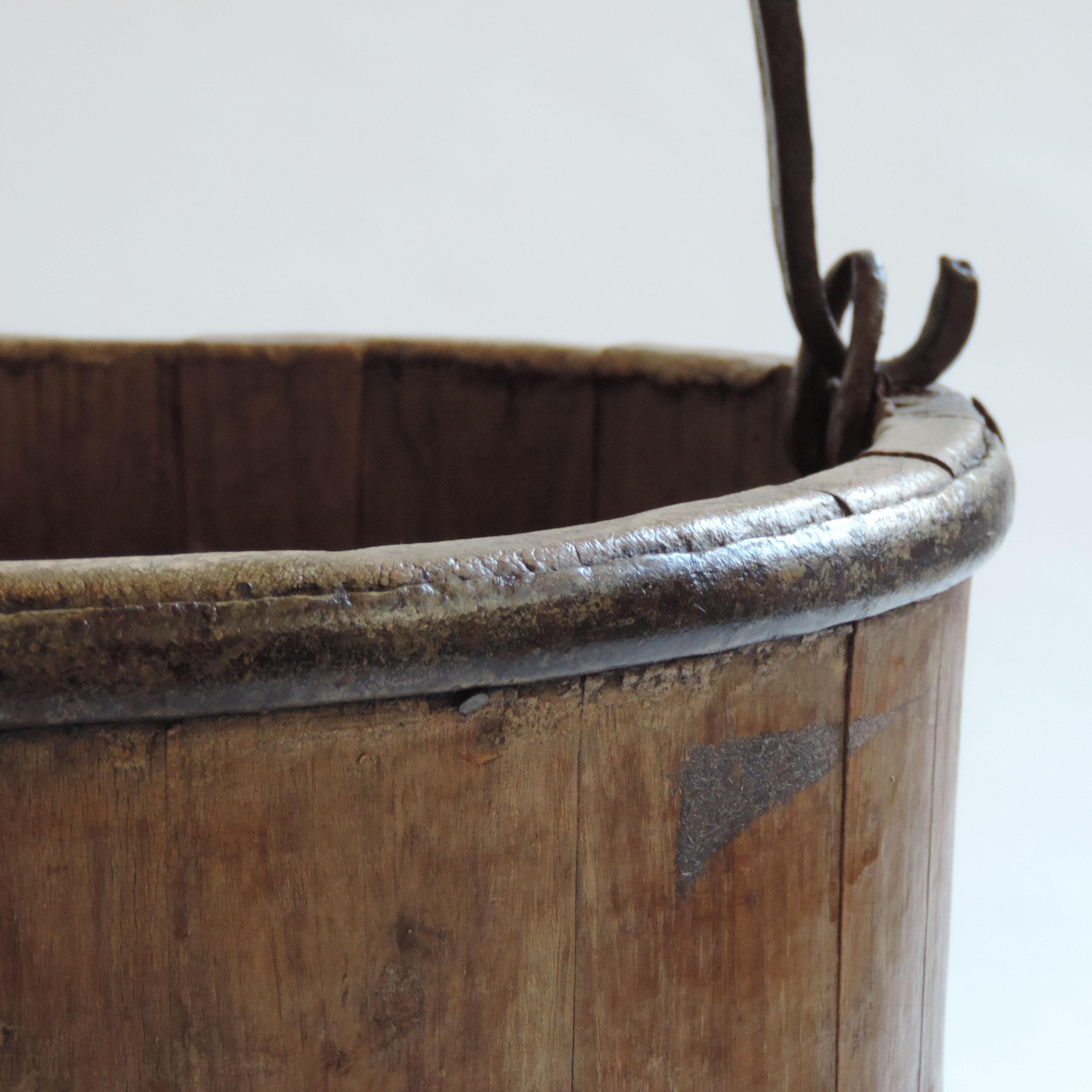 Antique European rural bucket in wood and iron, 1890s
Beautiful patina and wrought iron handle.