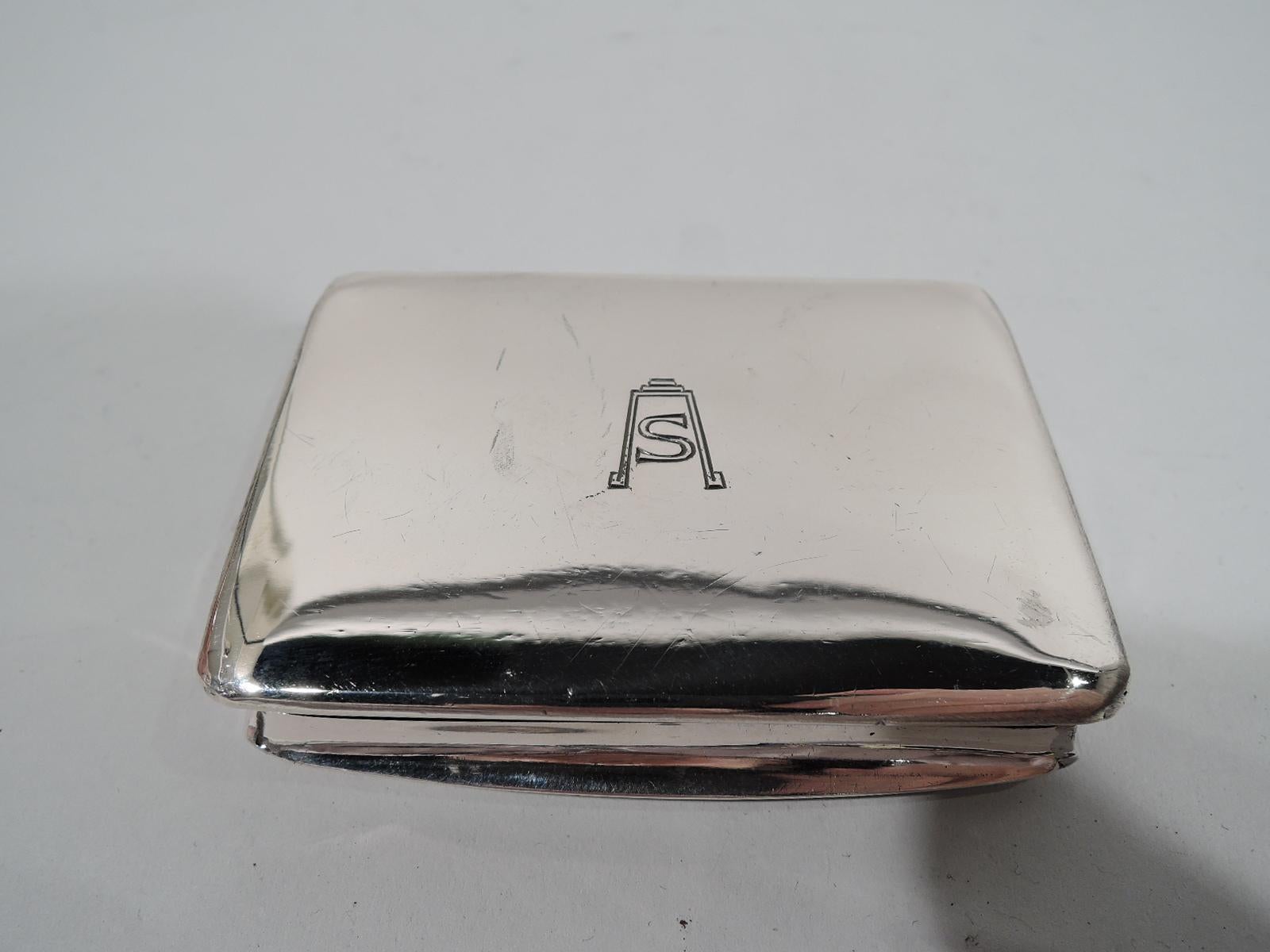 European silver case with enameled dog, ca 1910. Rectangular with concave sides and hinged cover. On cover top reposes a placid, recumbent mastiff with soulful eyes. Back plain with engraved Art Deco S-letter monogram. Interior gilt. Marked. 