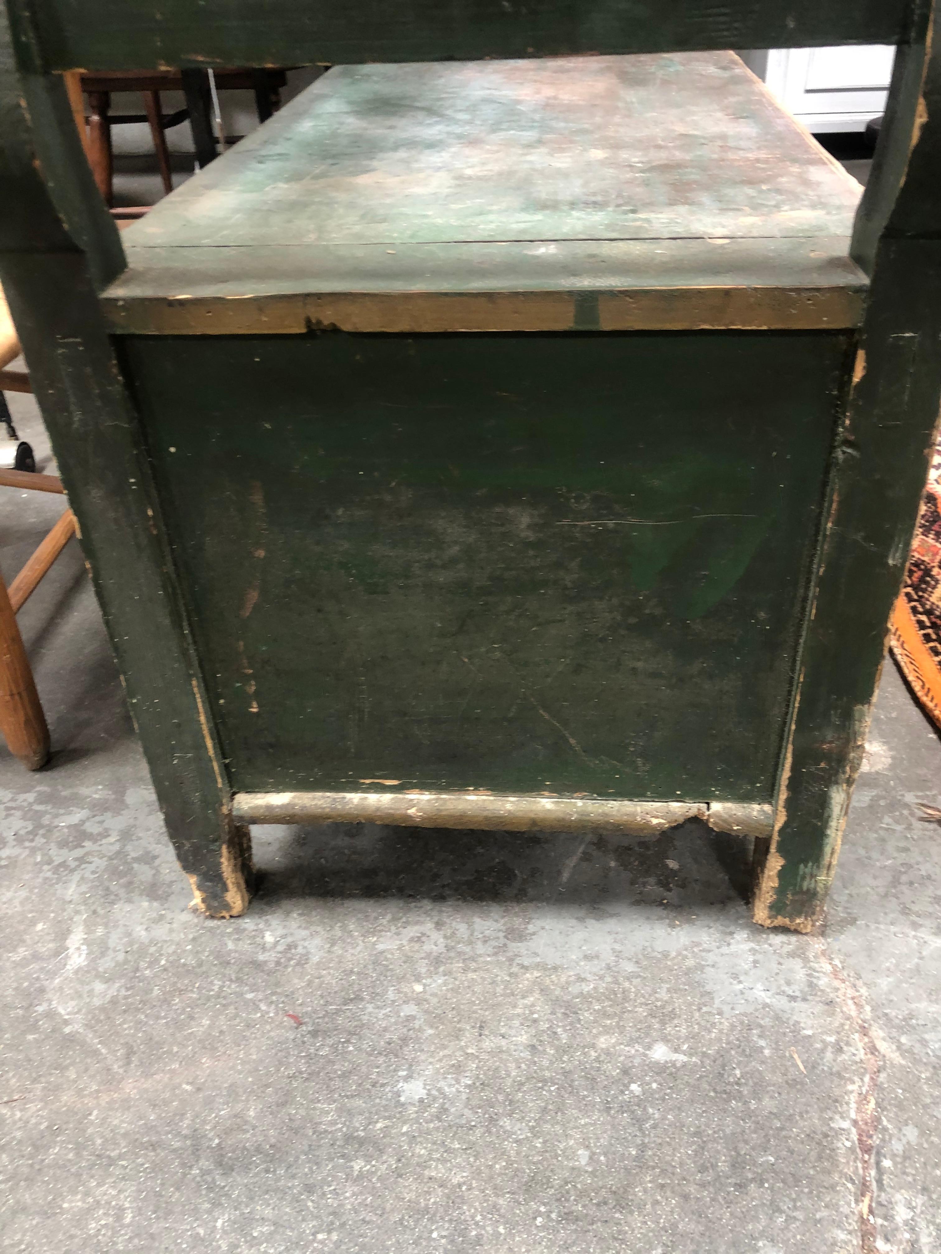 Antique storage bench is a European piece from the early 1900s. Painted forest green. Given that this piece is quite large, it would work well in any entryway, foyer, living room, or covered outdoor space. 

Measure: Seat height 19.5