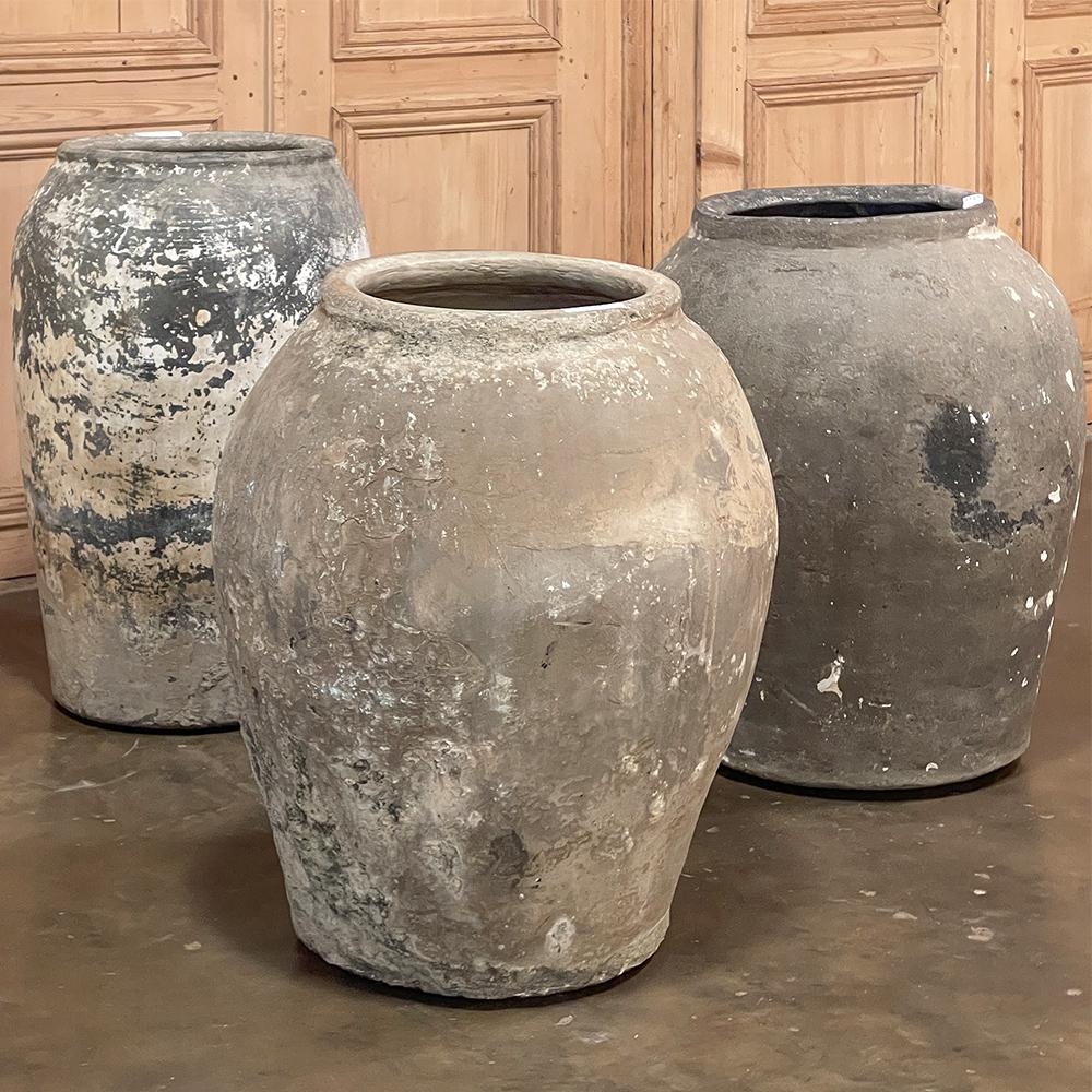Antique European Terra Cotta Olive jar will make a great interior accent, or can be used anywhere in the outdoors especially in the garden! Hand-thrown from local clays, it features a classic shape developed over the millennia to retain the most