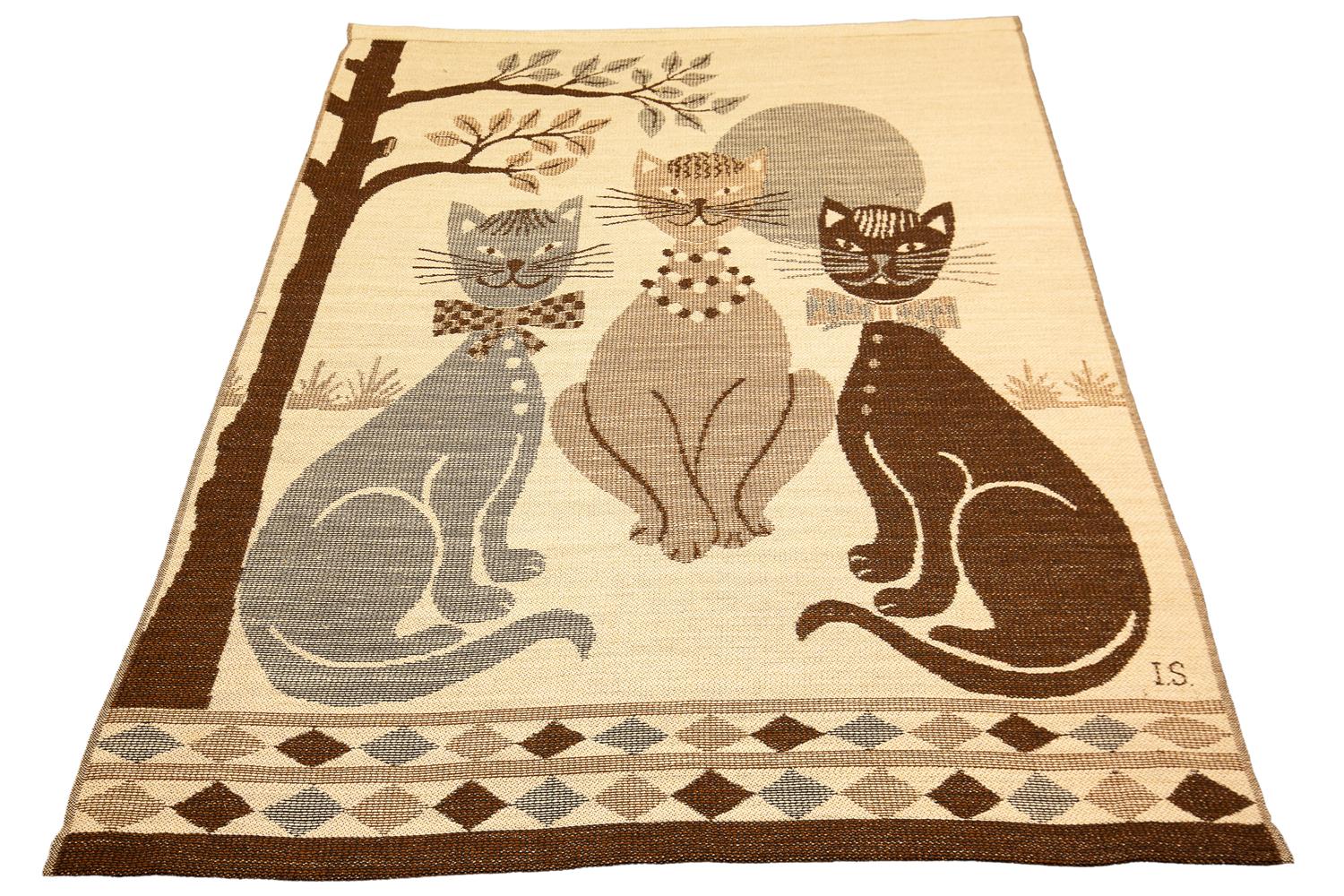 This is a European textile with a signature of IS in the bottom right-hand corner that measures 160 x 130CM in size. This piece depicts three cats sitting around each other two of them being male and one of them being female and having human