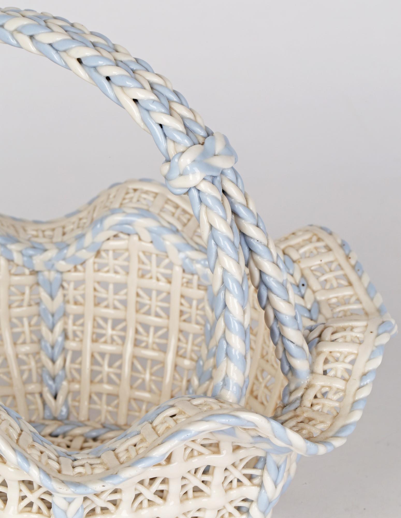 This must be one of the finest made pieces of porcelain we have encountered. A rare and exceptional antique porcelain open work handled basket, probably English and dating from the 19th century. The basket has an octagonal shaped body with panels