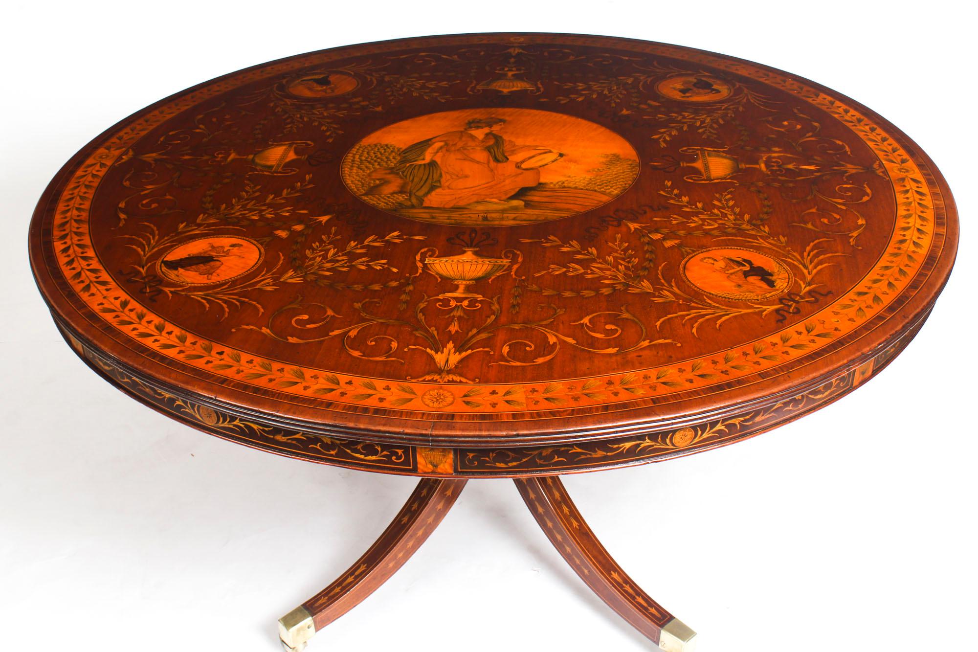 This is a fine exhibition quality English antique Victorian mahogany marquetry centre table attributed to the London master cabinet makers Edwards & Roberts, circa 1880 in date.
 
The circular table features the very highest quality satinwood